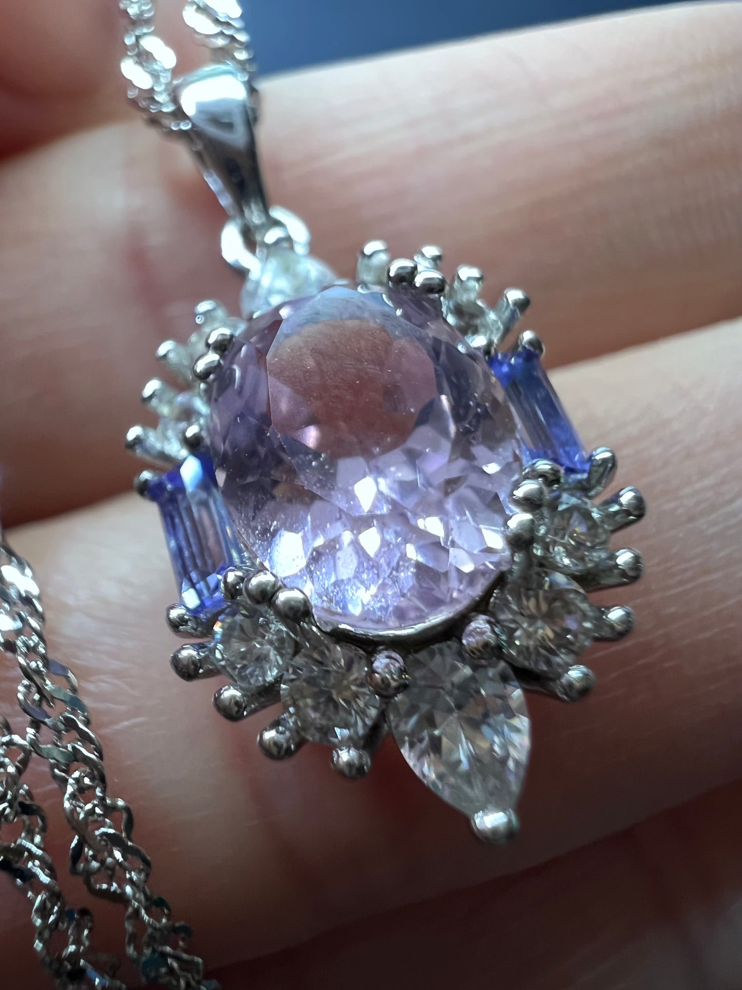 2.11ct Kunzite, 0.18ctw Tanzanite And 0.87ctw White Zircon Rhodium Over Silver halo Pendant With Chain