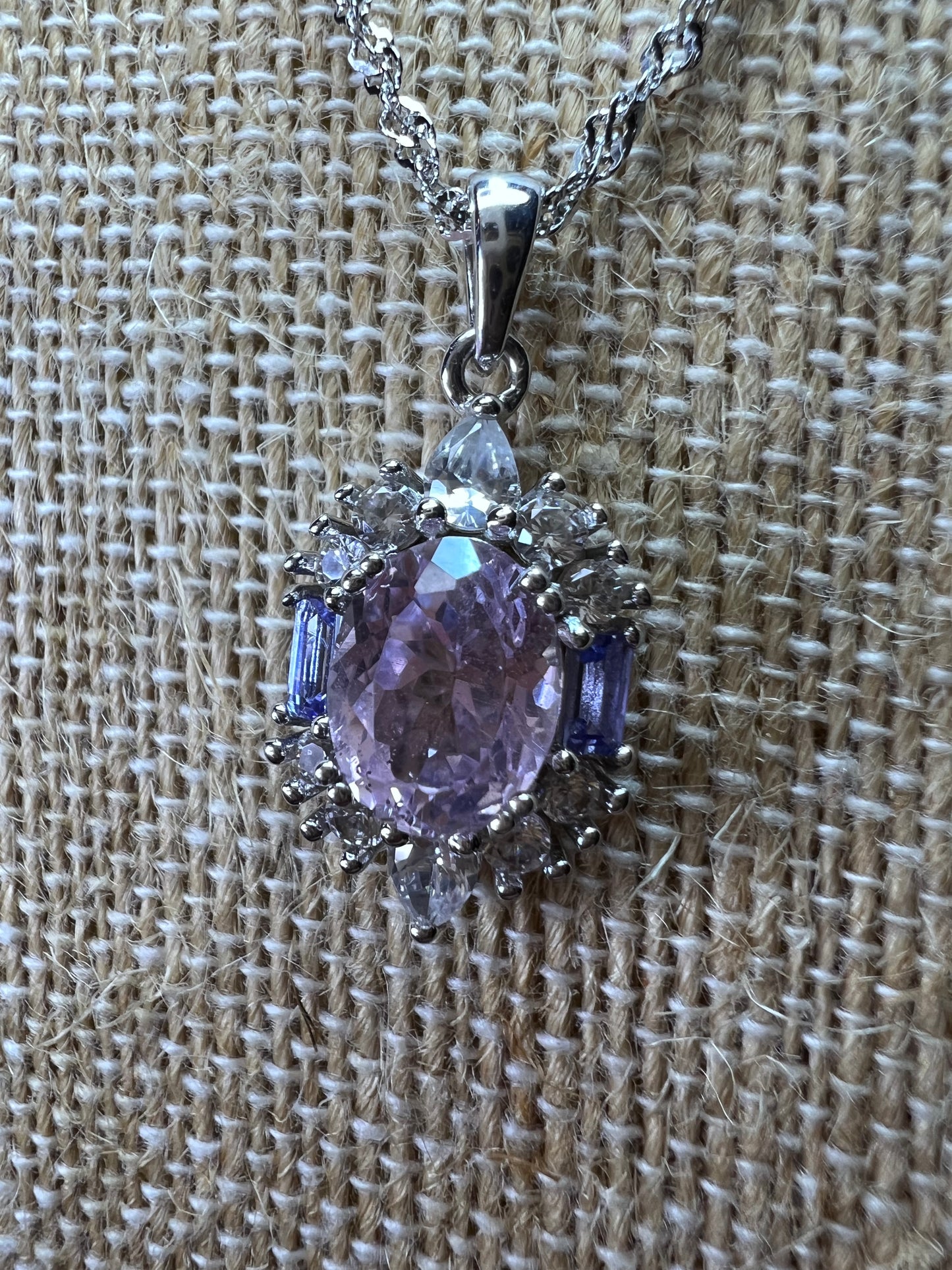 2.11ct Kunzite, 0.18ctw Tanzanite And 0.87ctw White Zircon Rhodium Over Silver halo Pendant With Chain