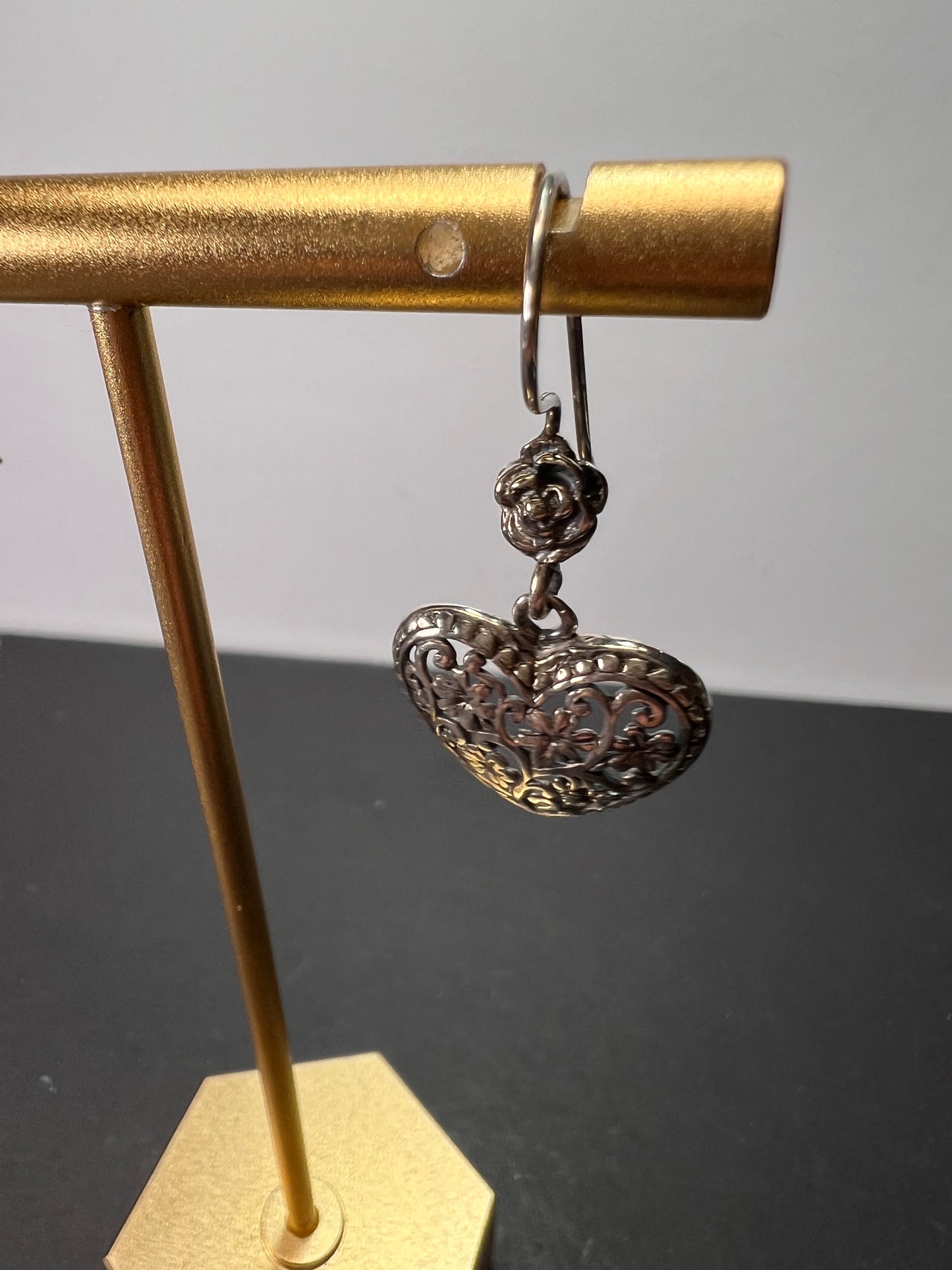 Sterling silver heart shaped earrings with floral design