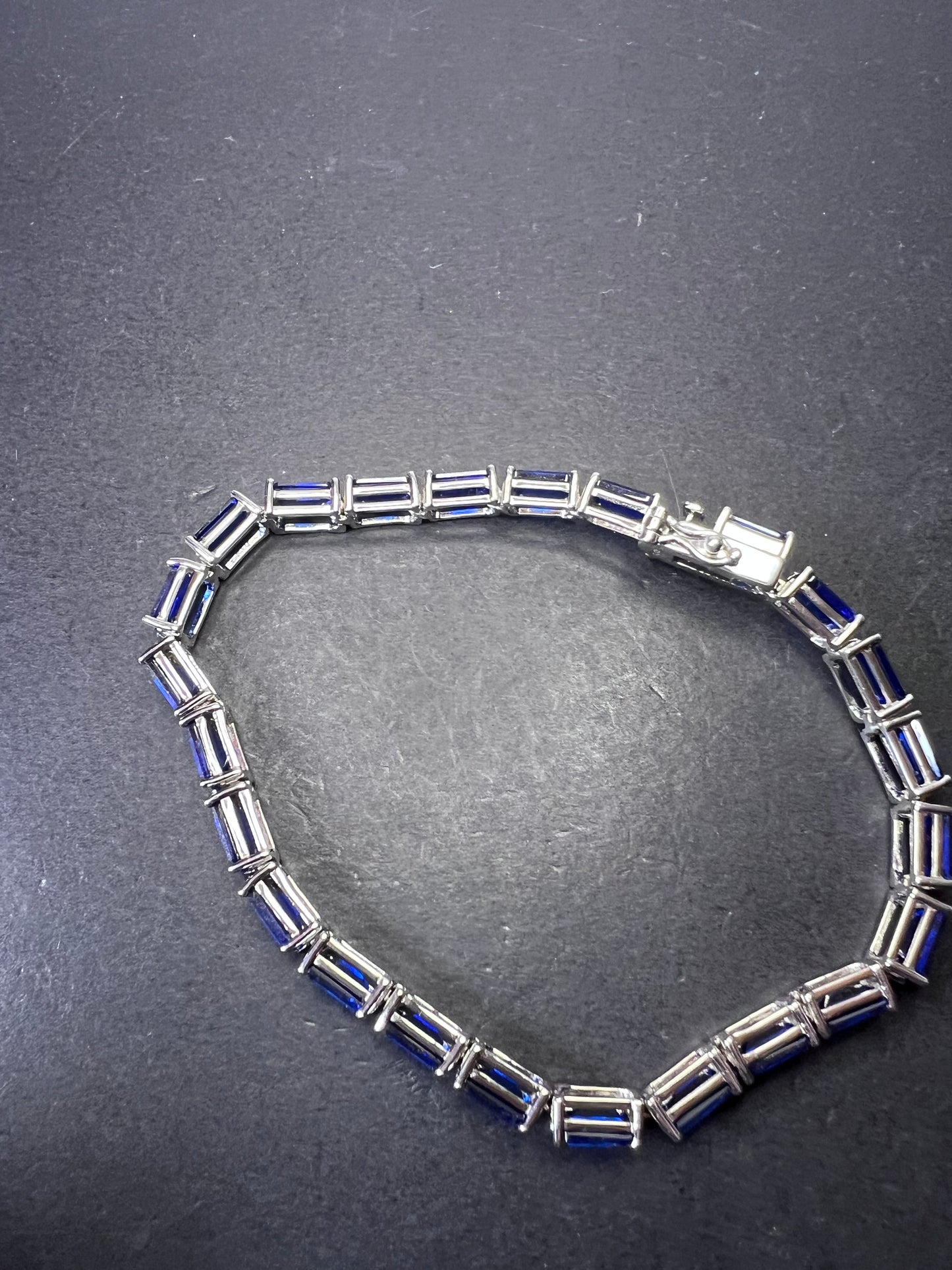 Lab created blue spinel emerald cut tennis bracelet in platinum over sterling silver 22.92 ctw