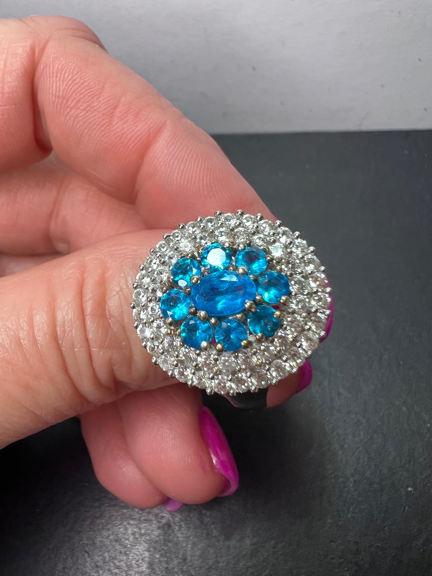 Neon blue apatite and white spinel halo cocktail ring in sterling silver size 9