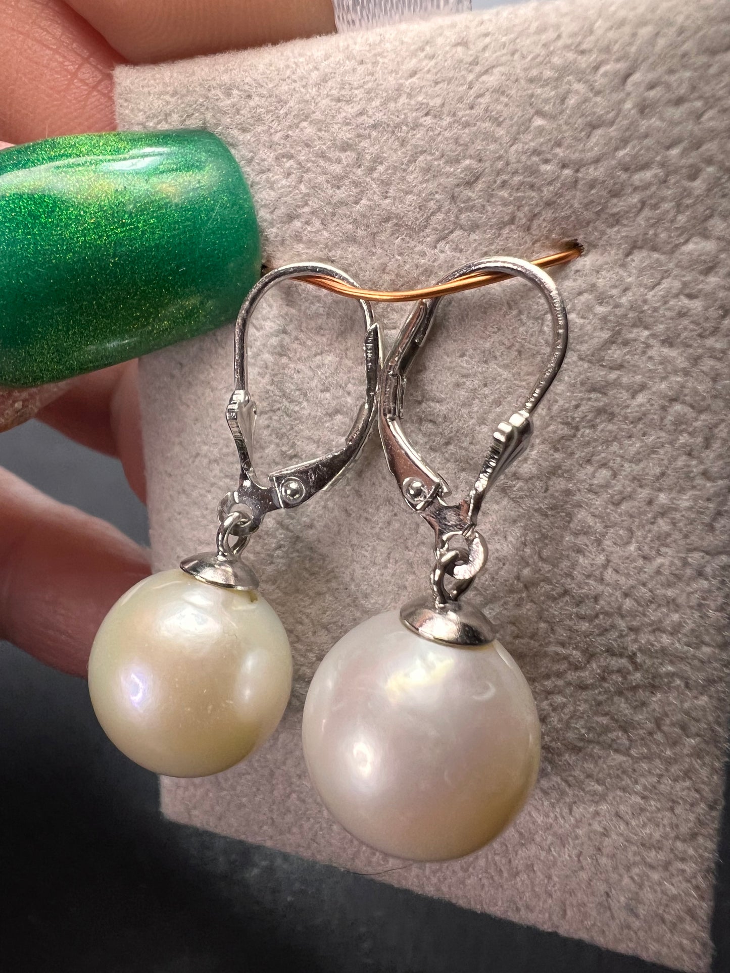 White cultured freshwater pearl earrings in rhodium over sterling silver lever backs