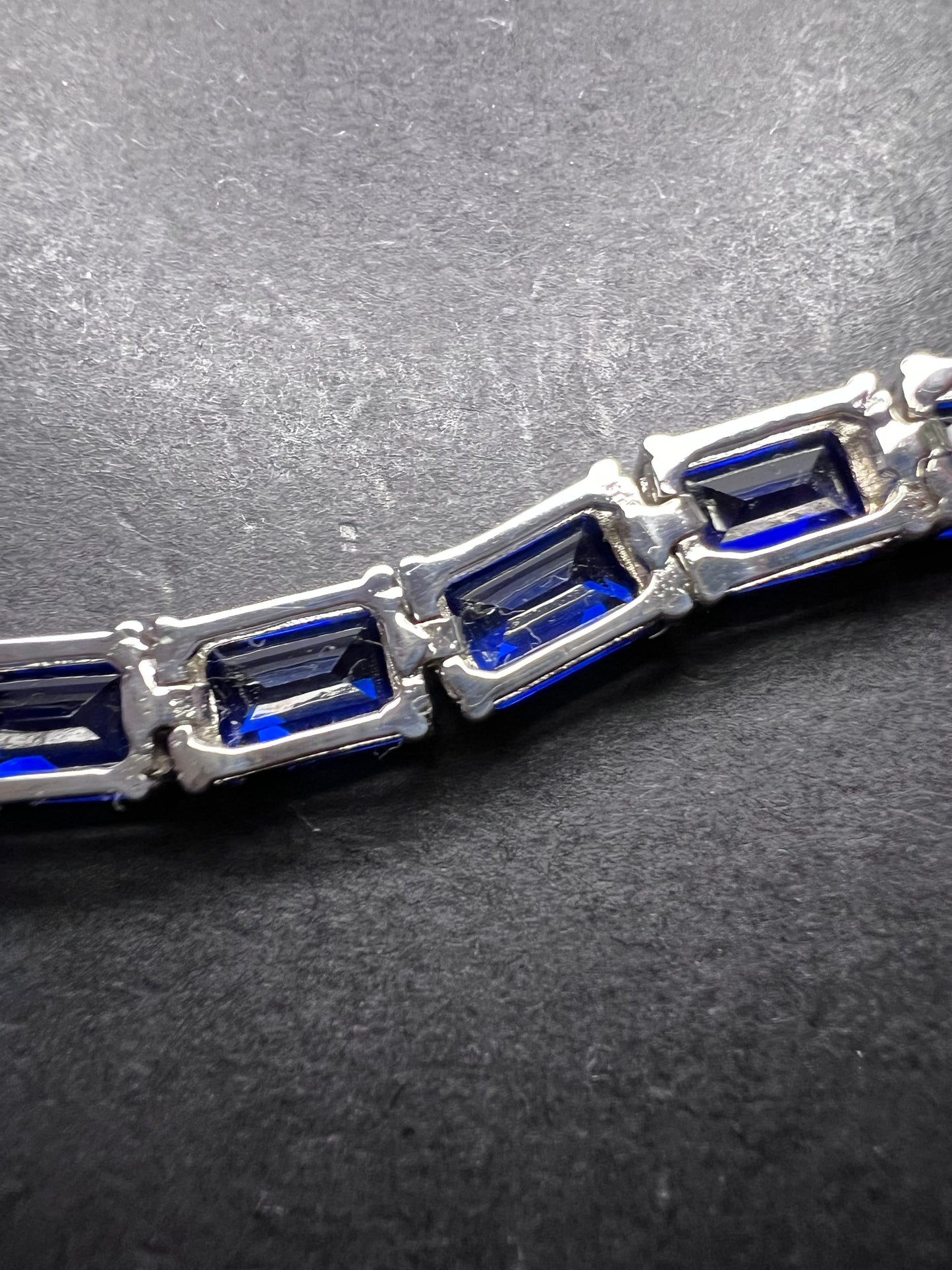 Lab created blue spinel emerald cut tennis bracelet in platinum over sterling silver 22.92 ctw