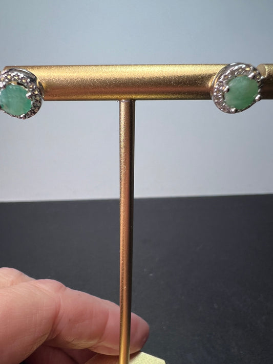 Emerald and zircon halo stud earrings In sterling silver