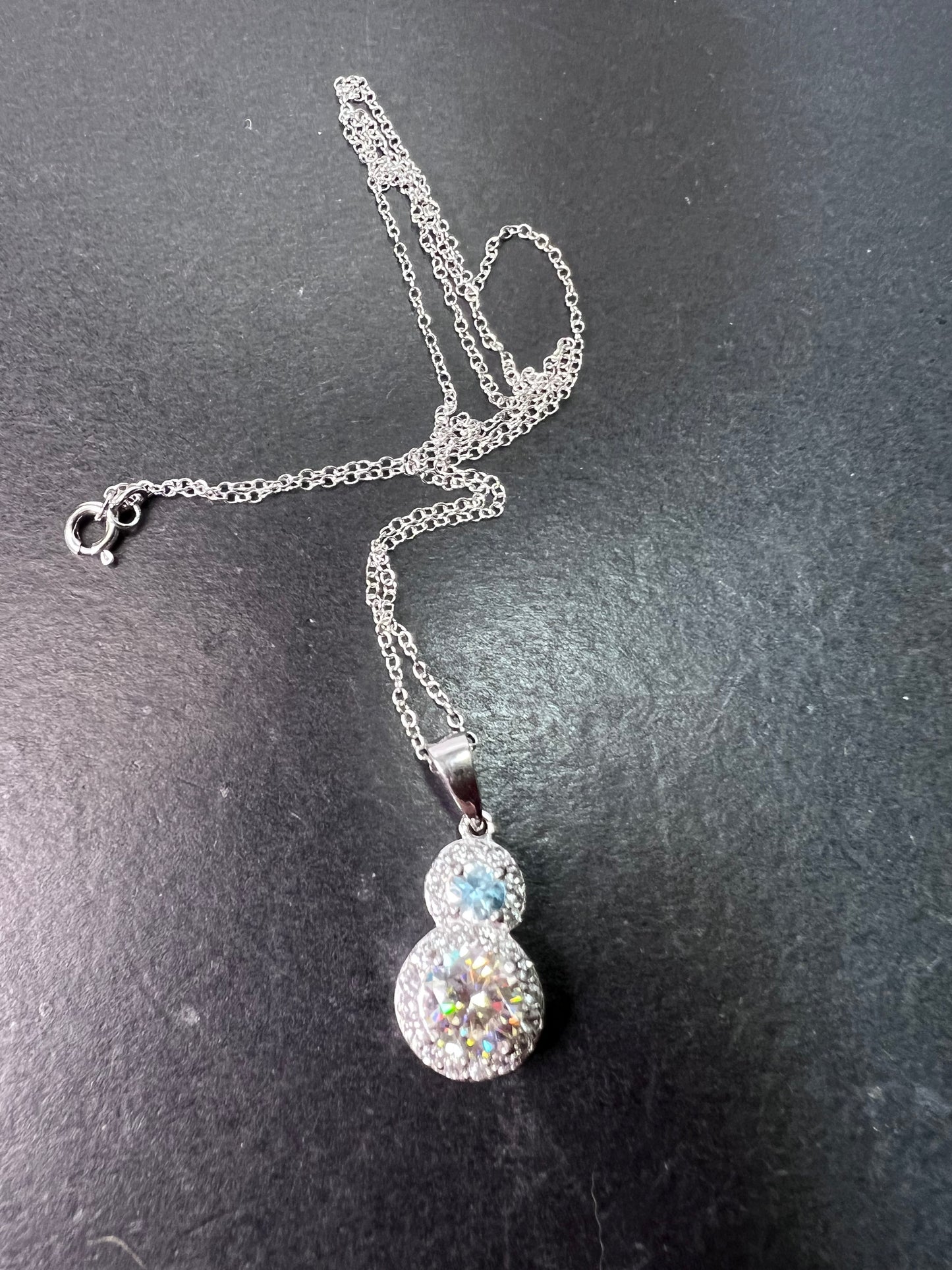 Strontium titanate and blue topaz sterling silver halo pendant with 18 inch chain necklace