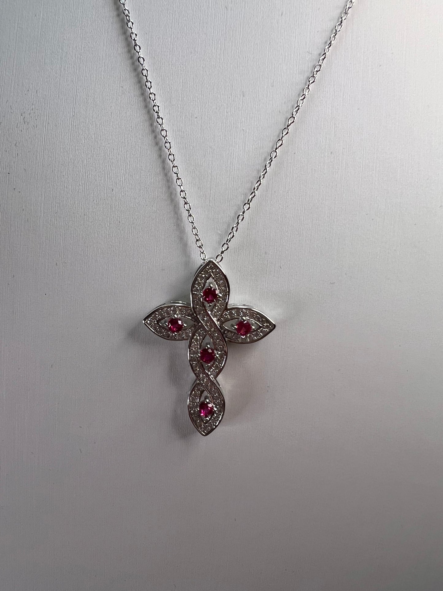 Lab grown ruby and CZ cross pendant and chain necklace in rhodium over sterling silver 18 inch