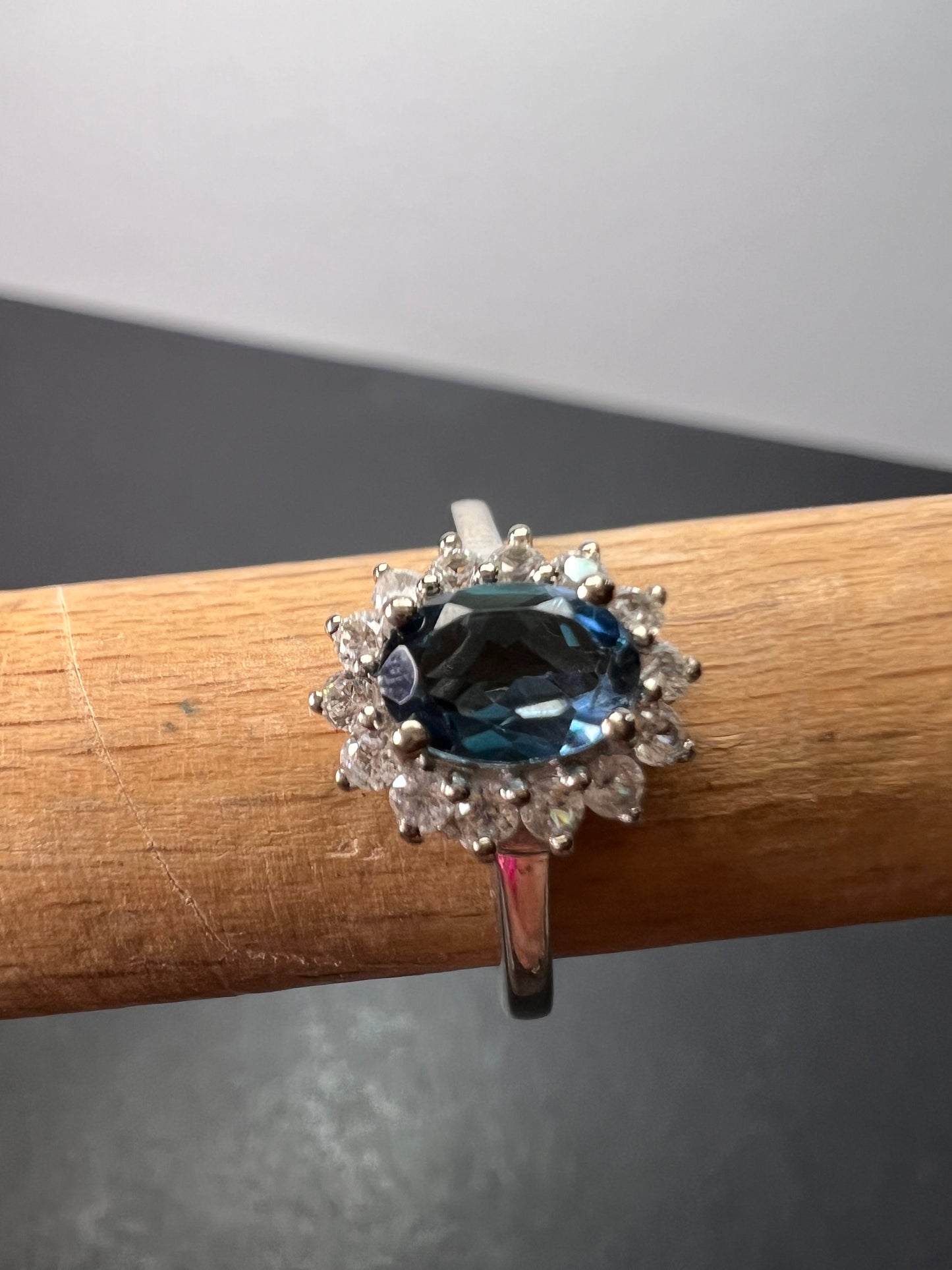 London blue topaz sunburst halo ring in platinum over sterling silver. ctw 1.40 size 5