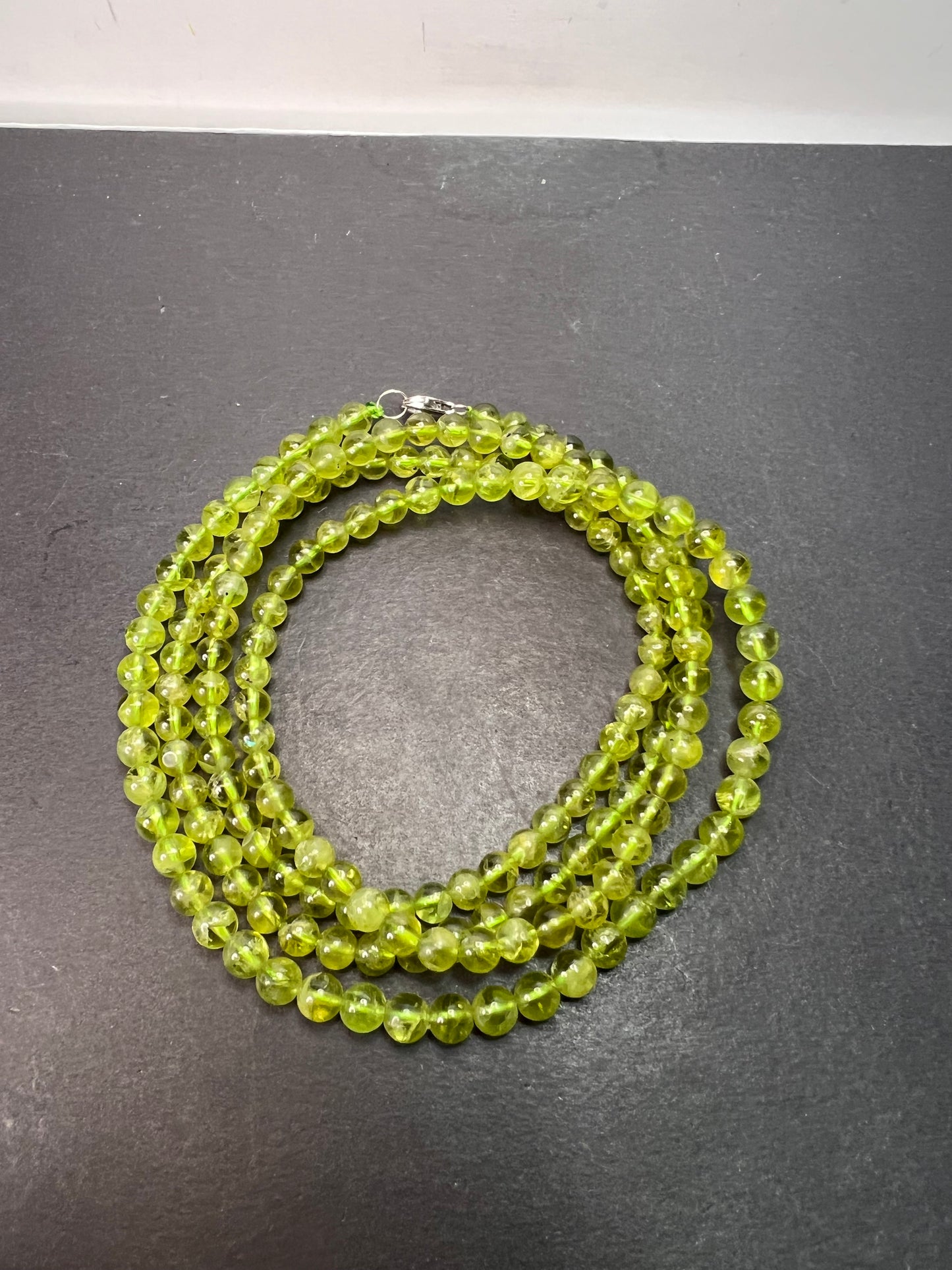 6mm high grade peridot beaded 36 inch necklace with sterling silver clasp