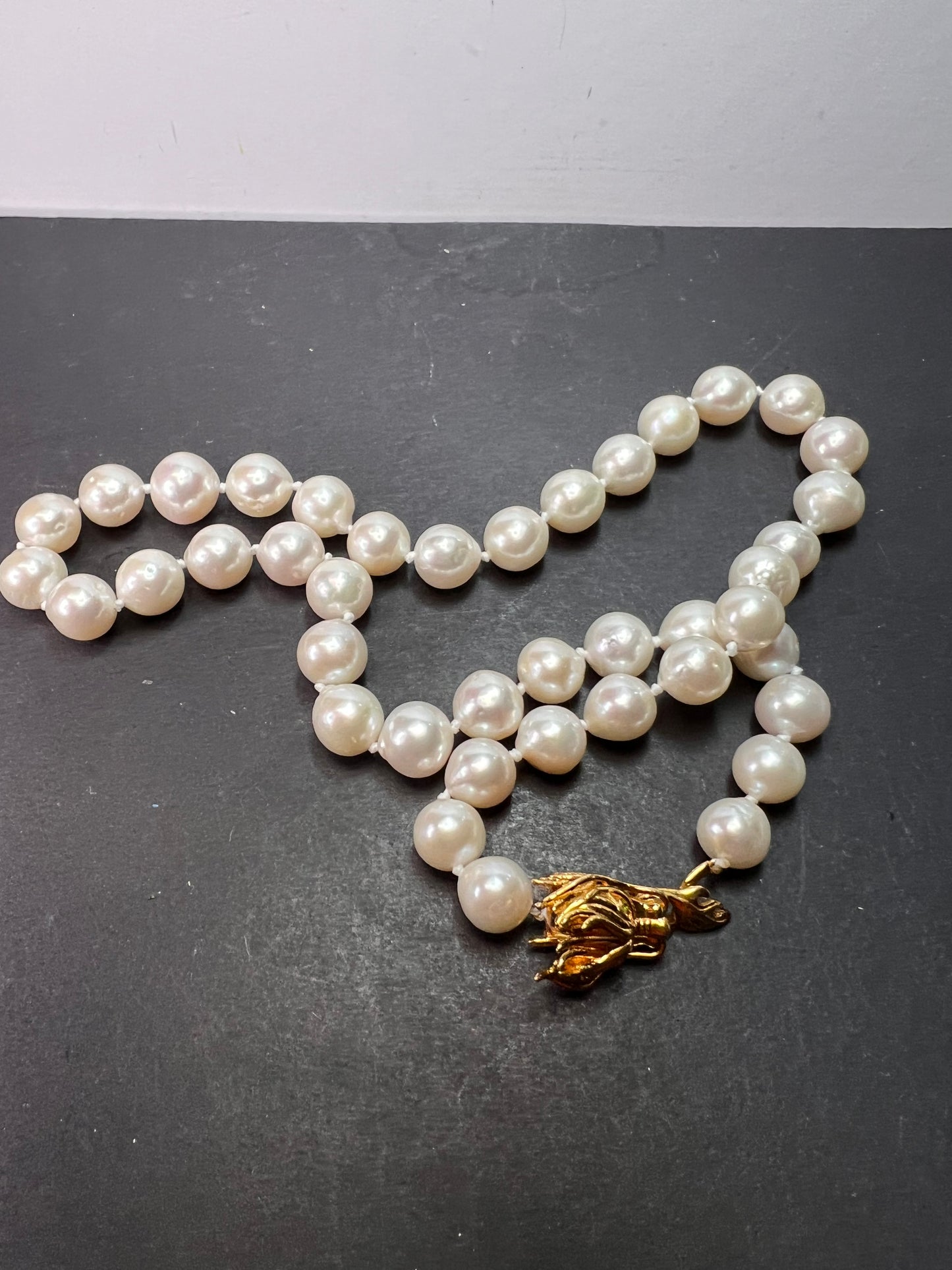 10-11mm white cultured pearl necklace with gold over sterling silver wolf head clasp 20 inch