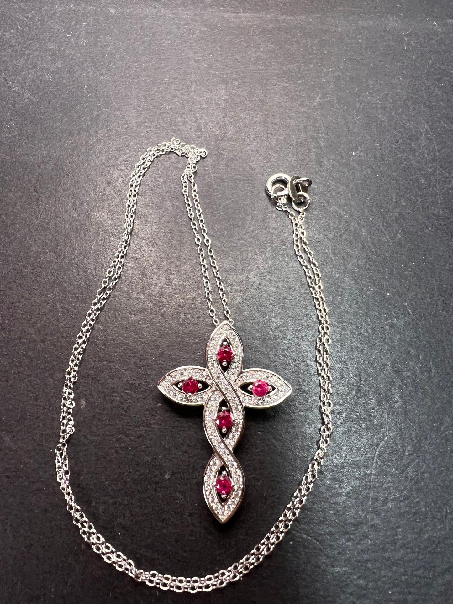 Lab grown ruby and CZ cross pendant and chain necklace in rhodium over sterling silver 18 inch