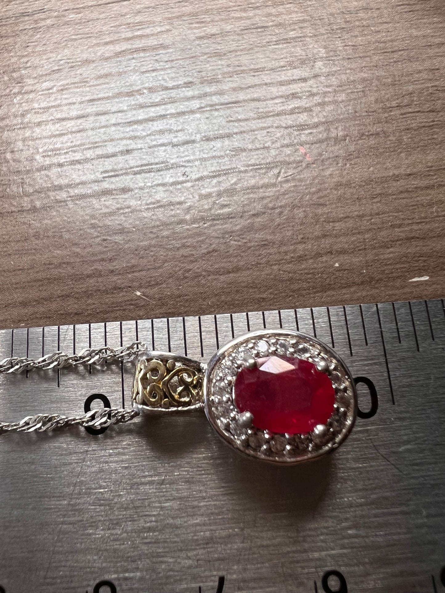 Ruby and zircon two toned halo pendant and chain necklace in sterling silver