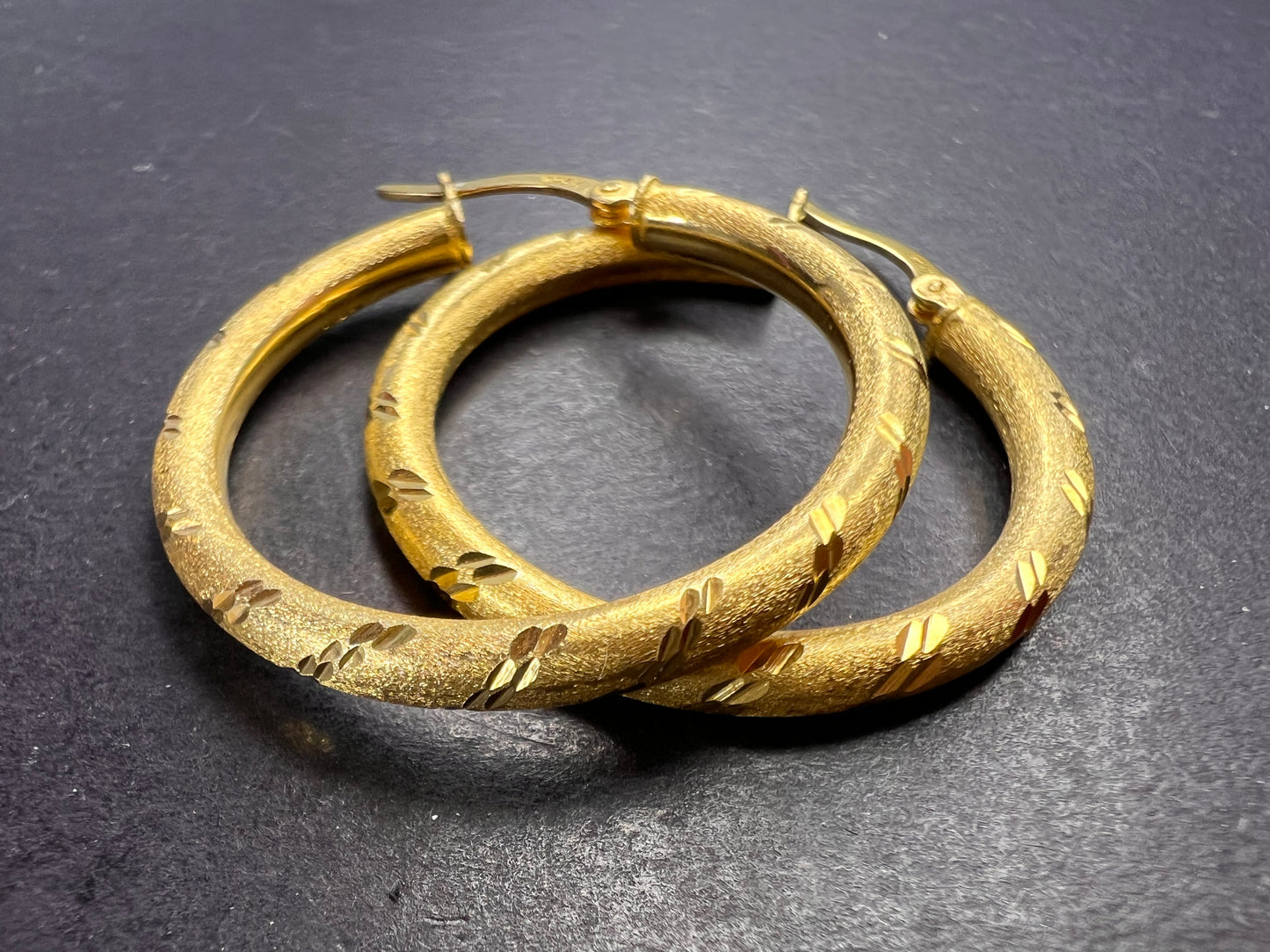 Satin finish diamond cut hoop earrings in yellow gold over sterling silver