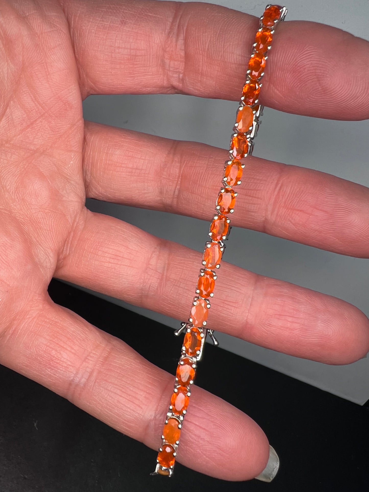 Mexican fire opal rhodium over sterling silver tennis bracelet