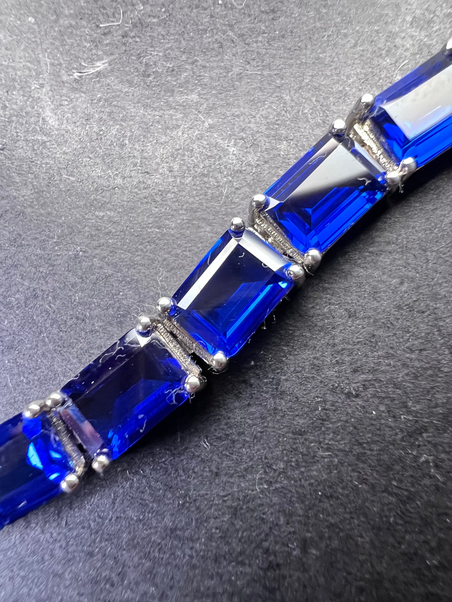 Lab created blue spinel emerald cut tennis bracelet in platinum over sterling silver 22.92 ctw