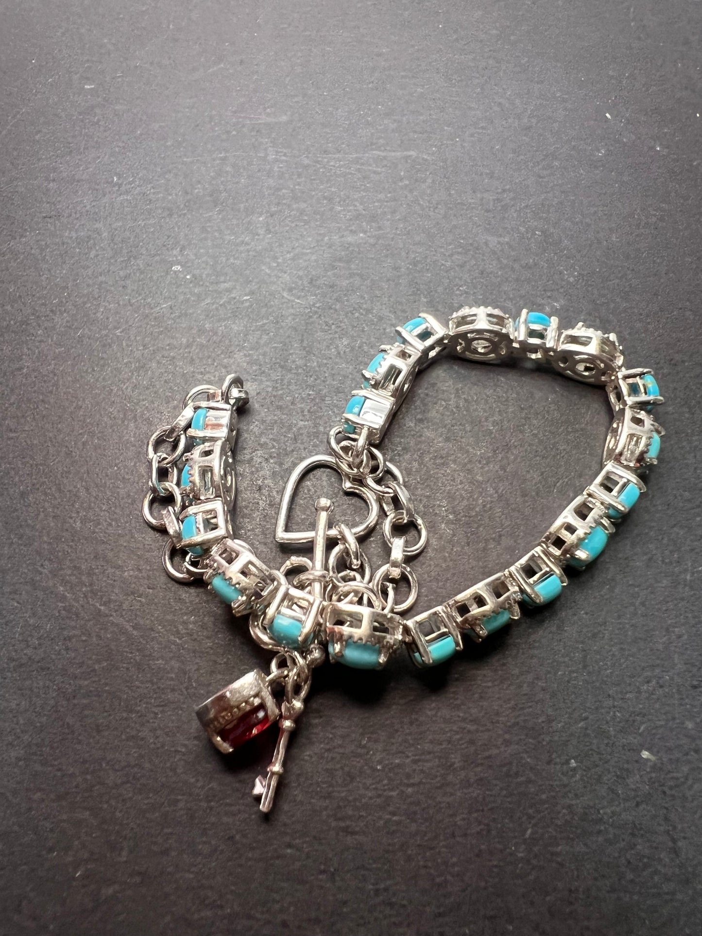 Sleeping Beauty turquoise sterling silver key and heart charm bracelet with toggle clasp and ruby