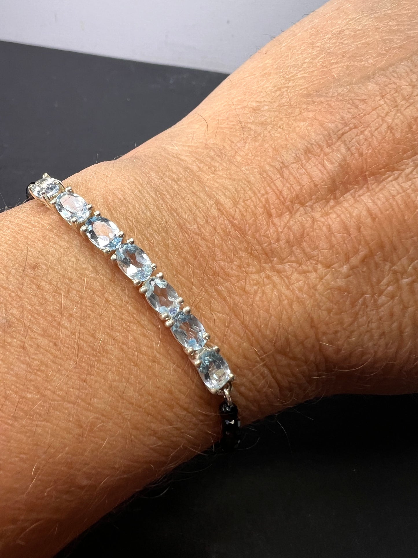 Black spinel and blue topaz bracelet with sterling lobster clasp