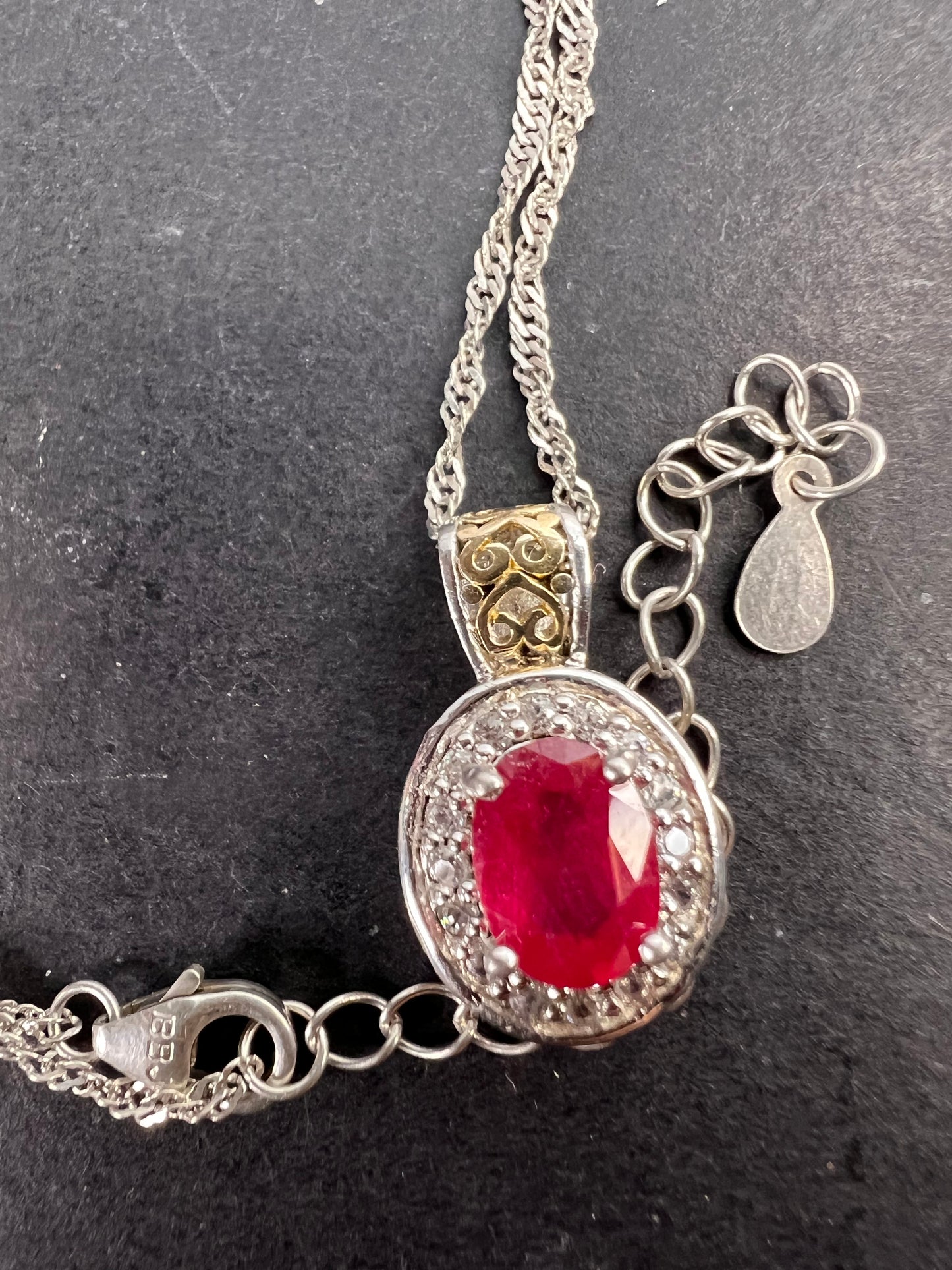 Ruby and zircon two toned halo pendant and chain necklace in sterling silver