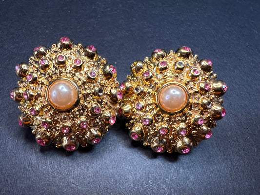 Signed Hutton Wilkinson Sea Urchin clip on earrings in gold tone with pink stones