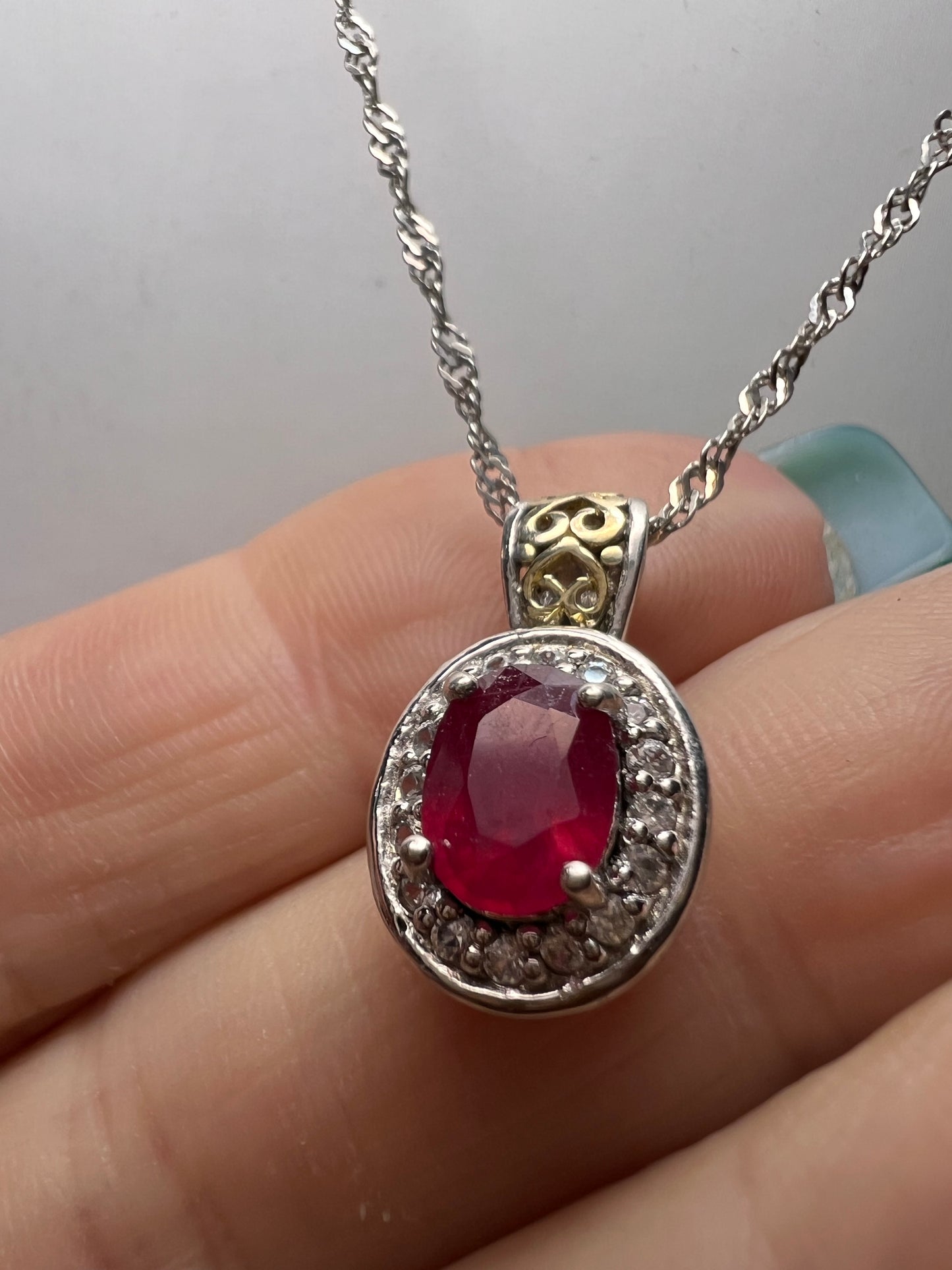 Ruby and zircon two toned halo pendant and chain necklace in sterling silver