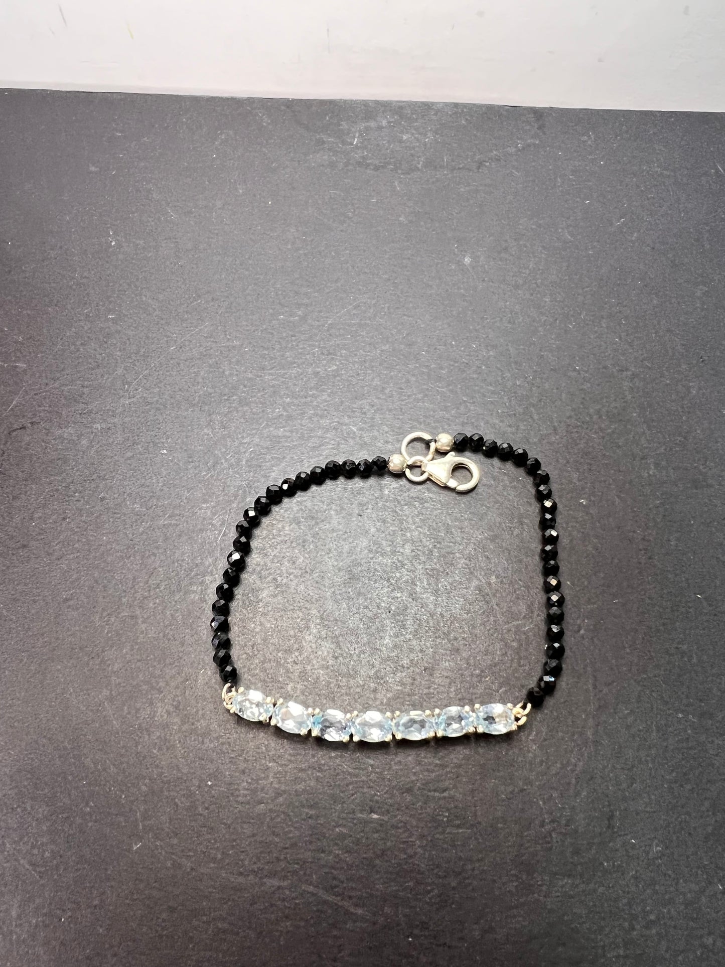 Black spinel and blue topaz bracelet with sterling lobster clasp