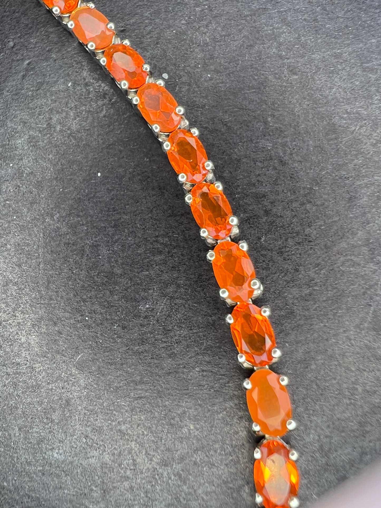 Mexican fire opal rhodium over sterling silver tennis bracelet