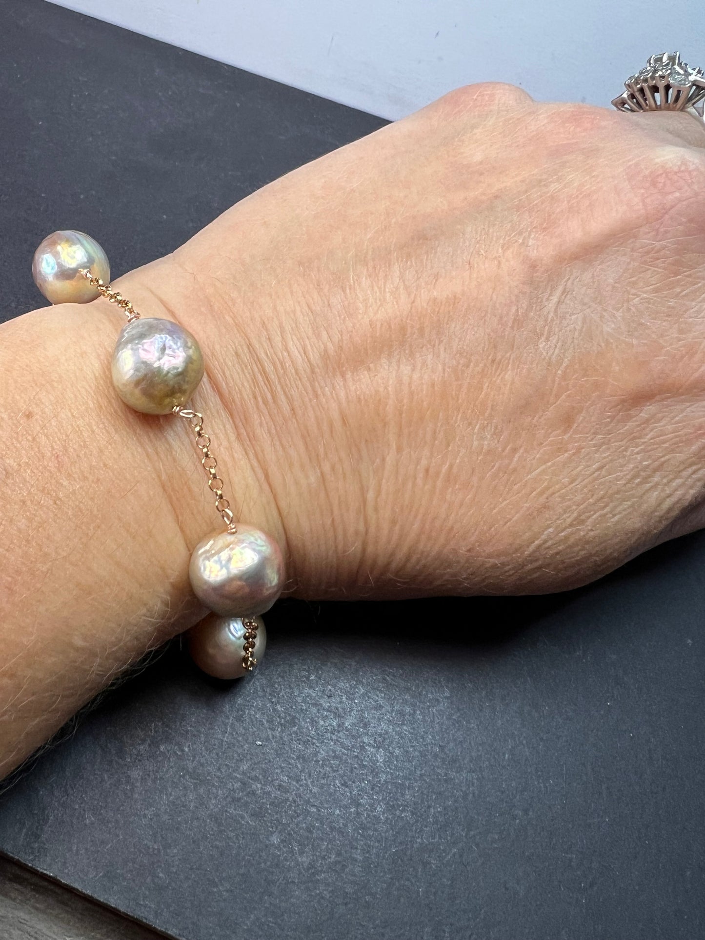 Multi colored baroque pearl station bracelet in rose gold over Sterling silver