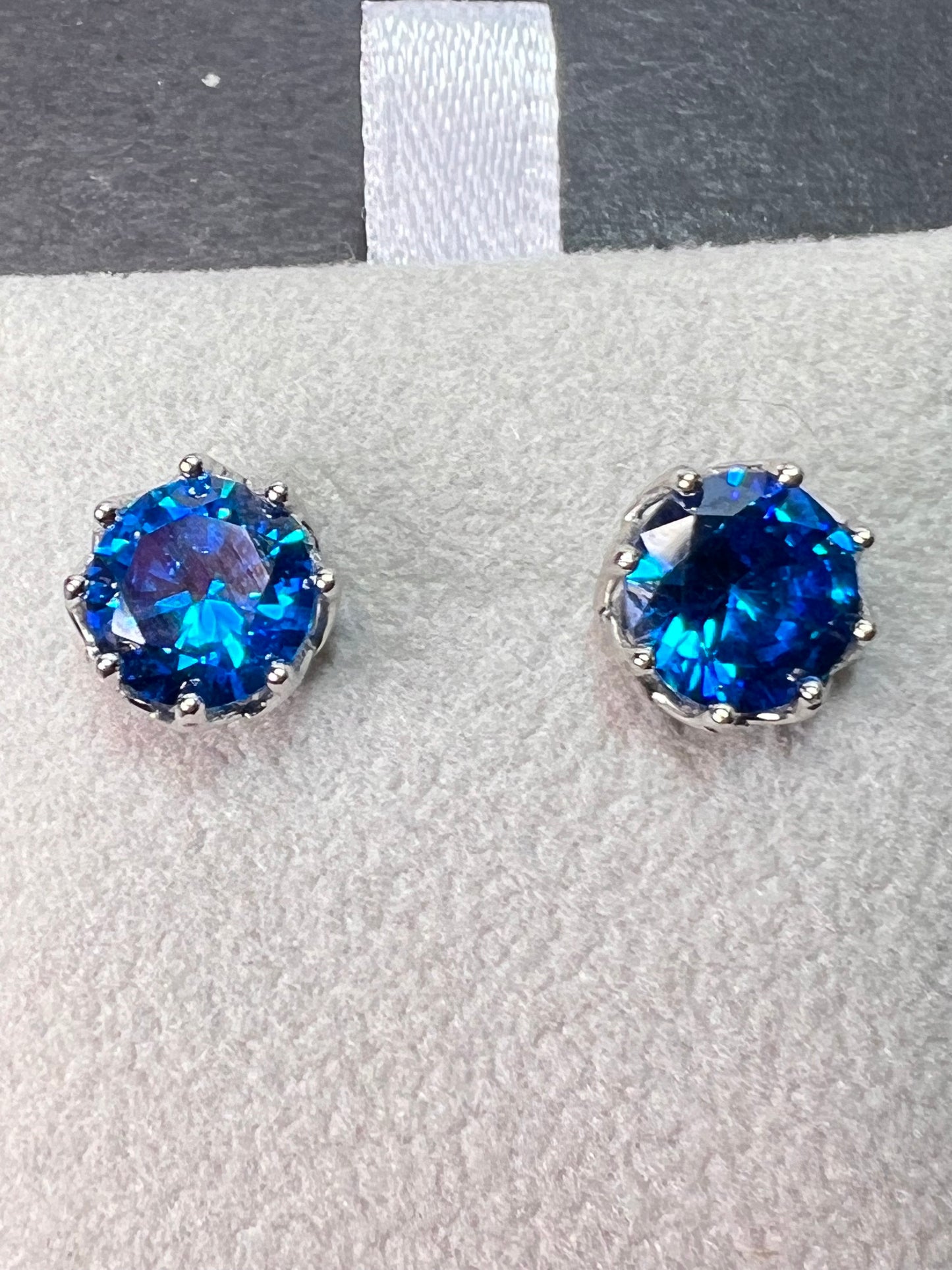 YGI blue CZ rhodium over sterling silver solitaire stud earrings