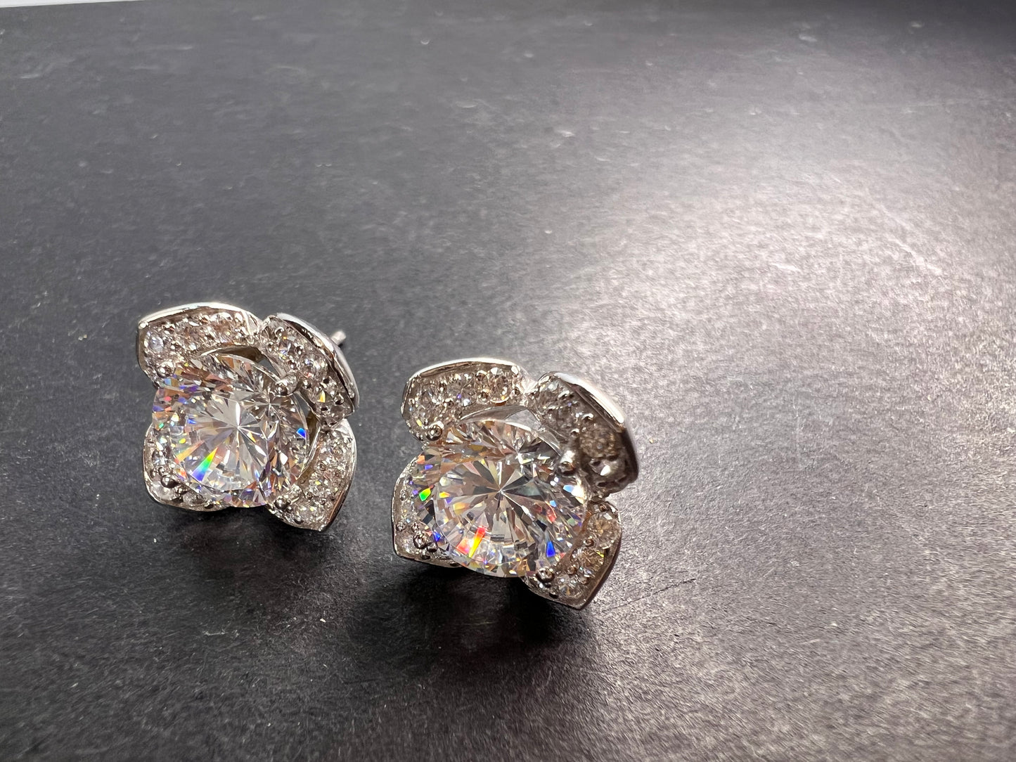 CZ floral styled stud earrings in rhodium over sterling silver