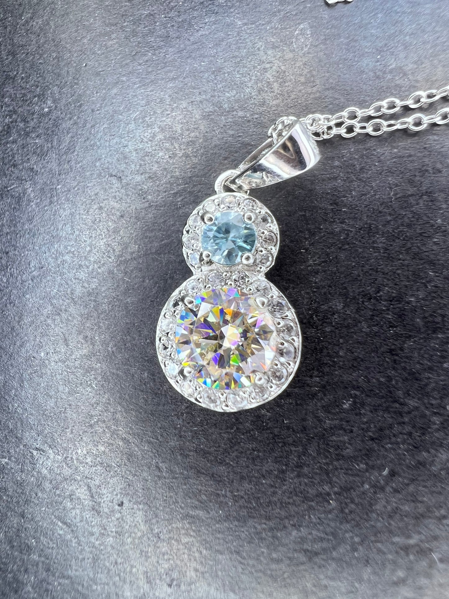 Strontium titanate and blue topaz sterling silver halo pendant with 18 inch chain necklace