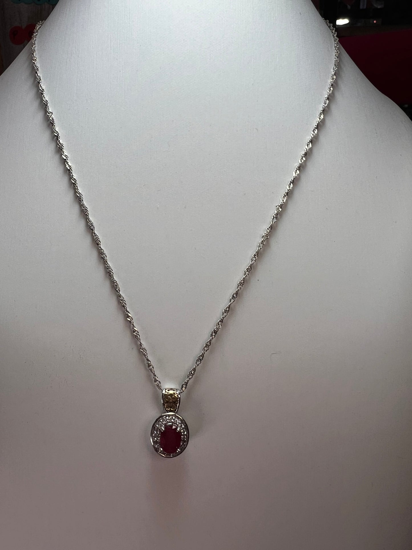 Ruby and zircon two toned halo pendant and chain necklace in sterling silver