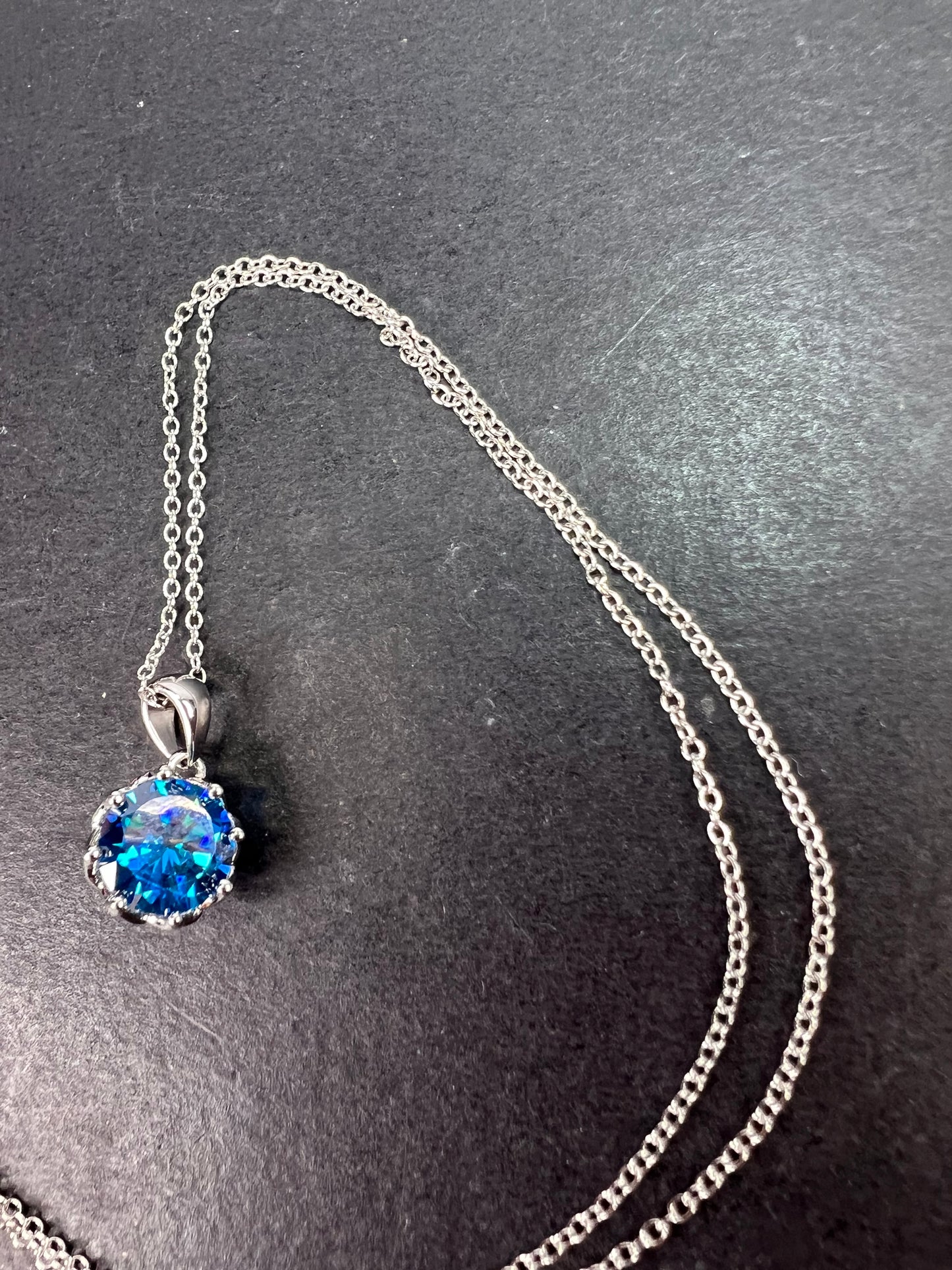 YGI blue CZ rhodium over sterling silver solitaire pendant and chain