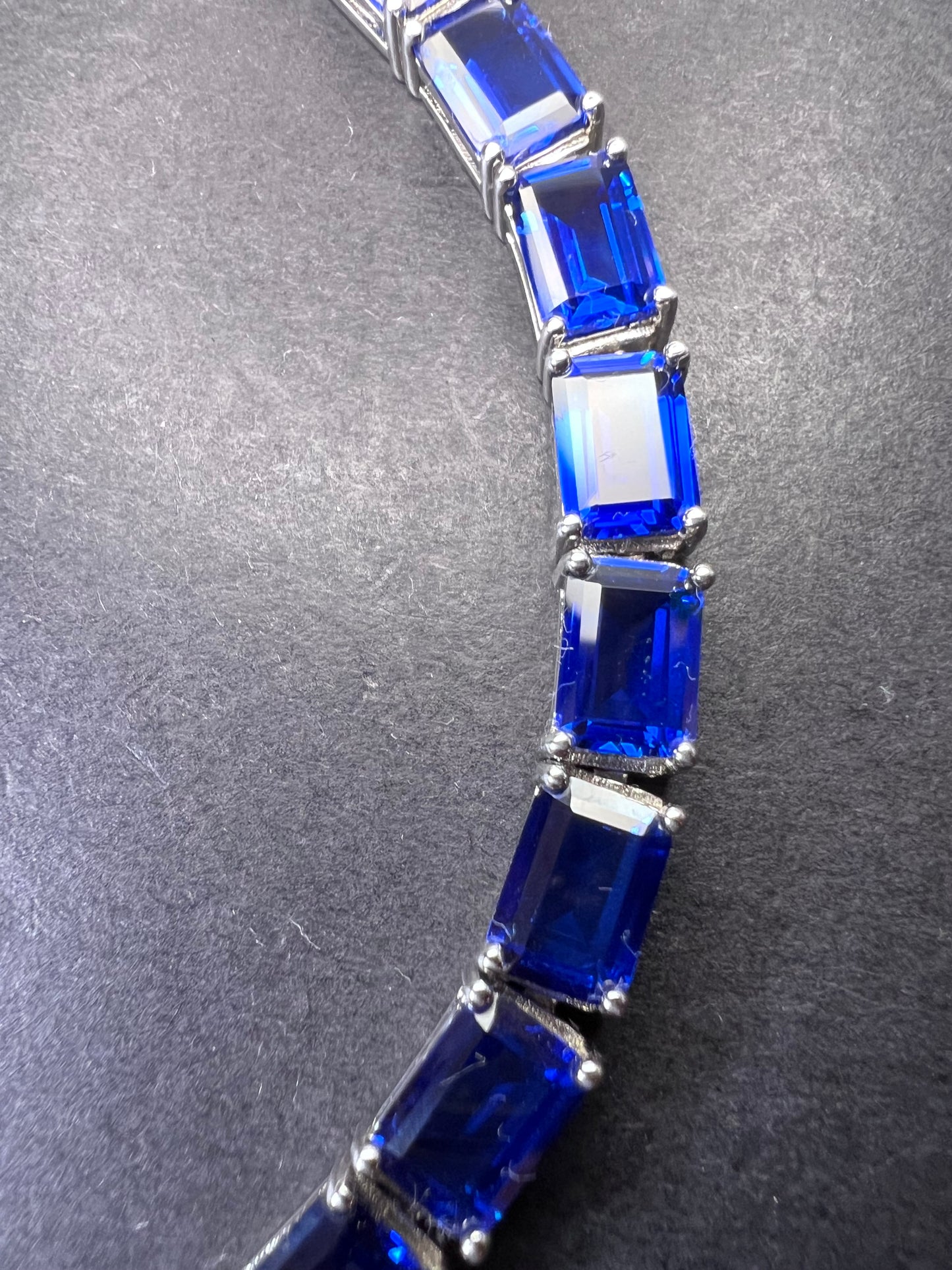 Lab created blue spinel emerald cut tennis bracelet in platinum over sterling silver 22.92 ctw