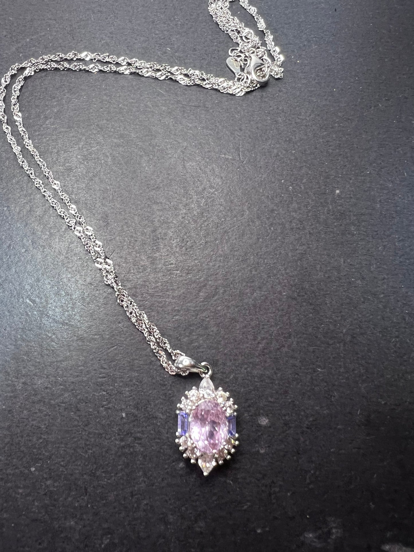 2.11ct Kunzite, 0.18ctw Tanzanite And 0.87ctw White Zircon Rhodium Over Silver halo Pendant With Chain