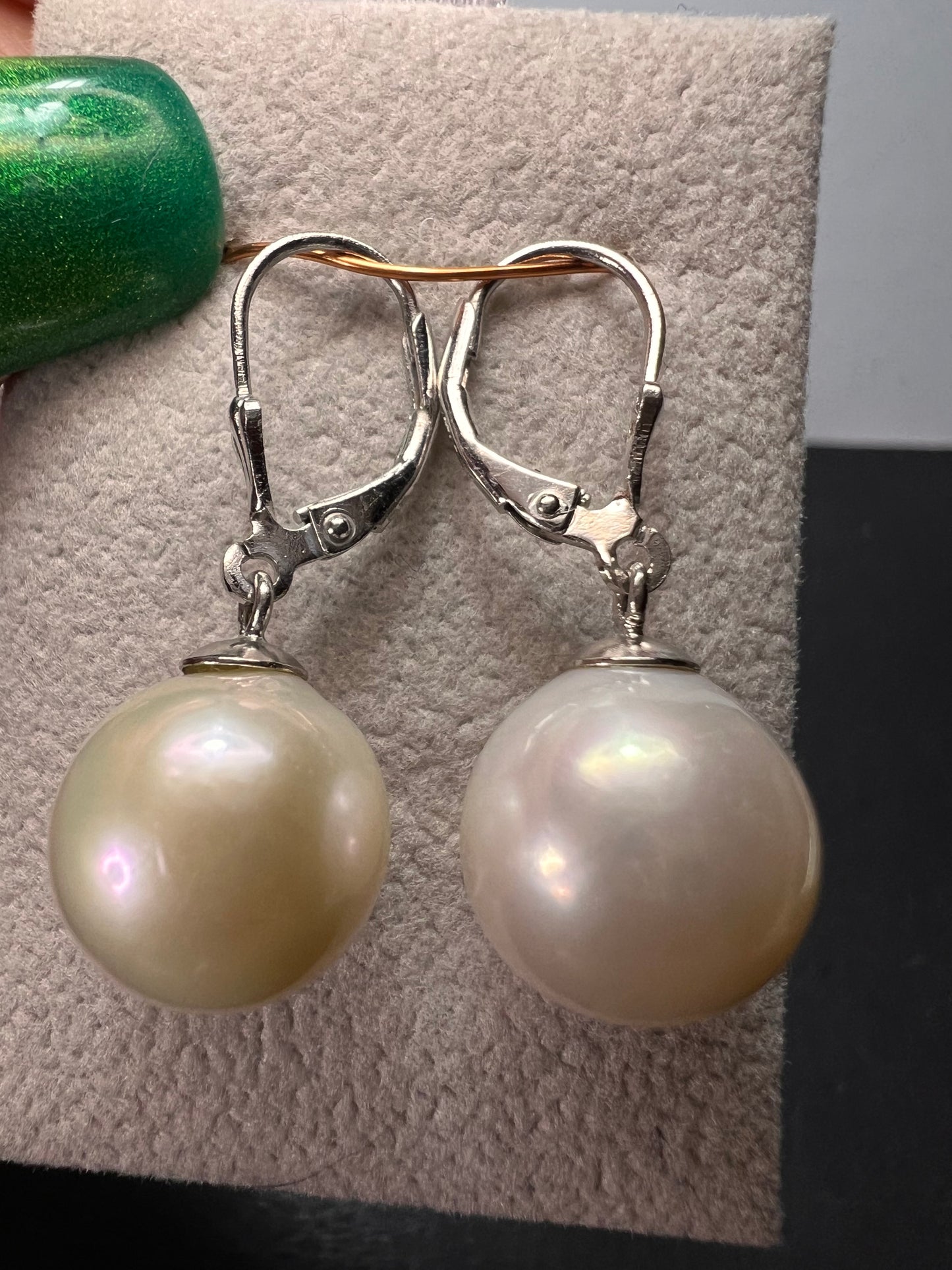 White cultured freshwater pearl earrings in rhodium over sterling silver lever backs