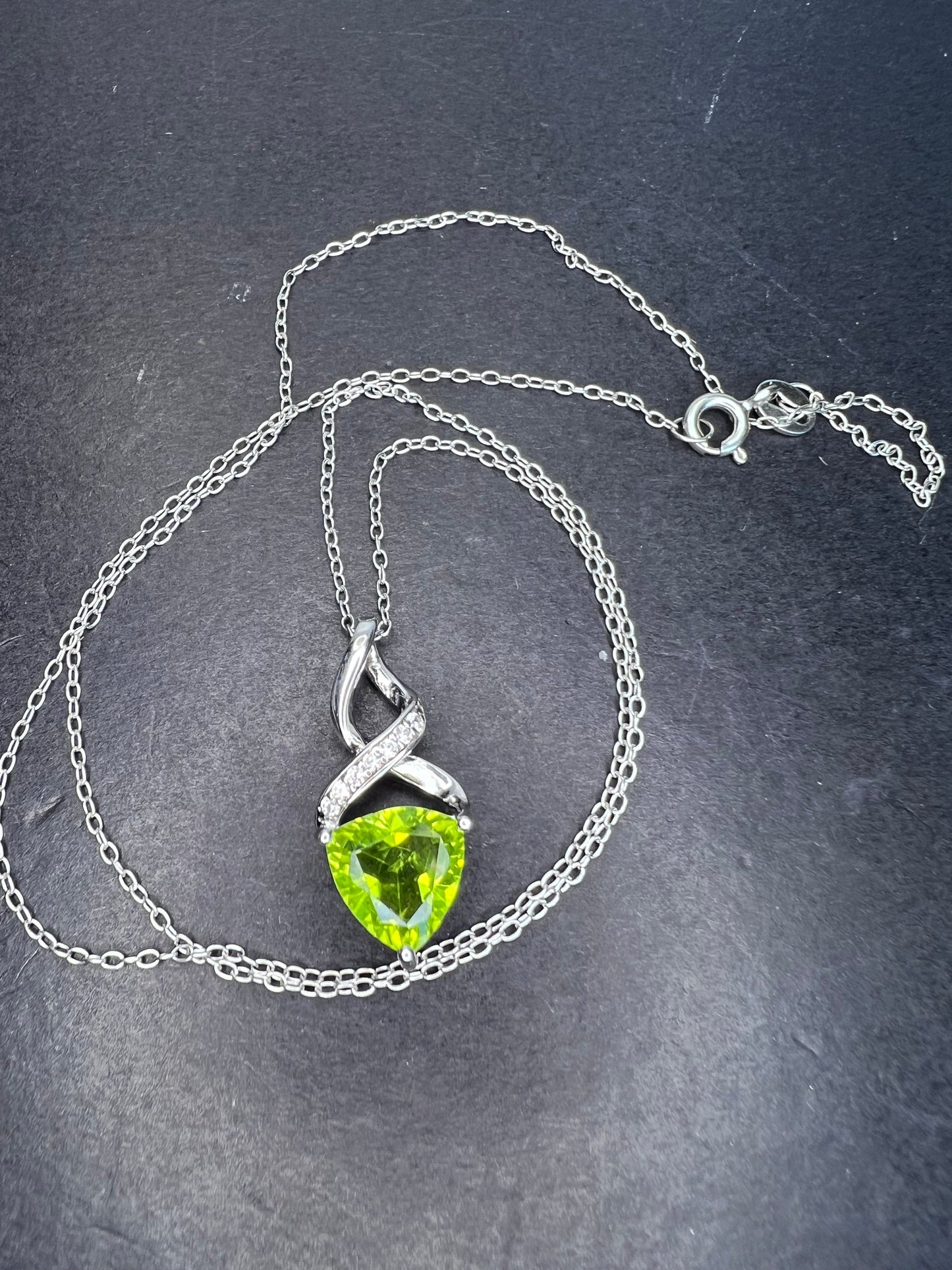 Trilliant cut peridot and sterling silver pendant and 18 inch chain