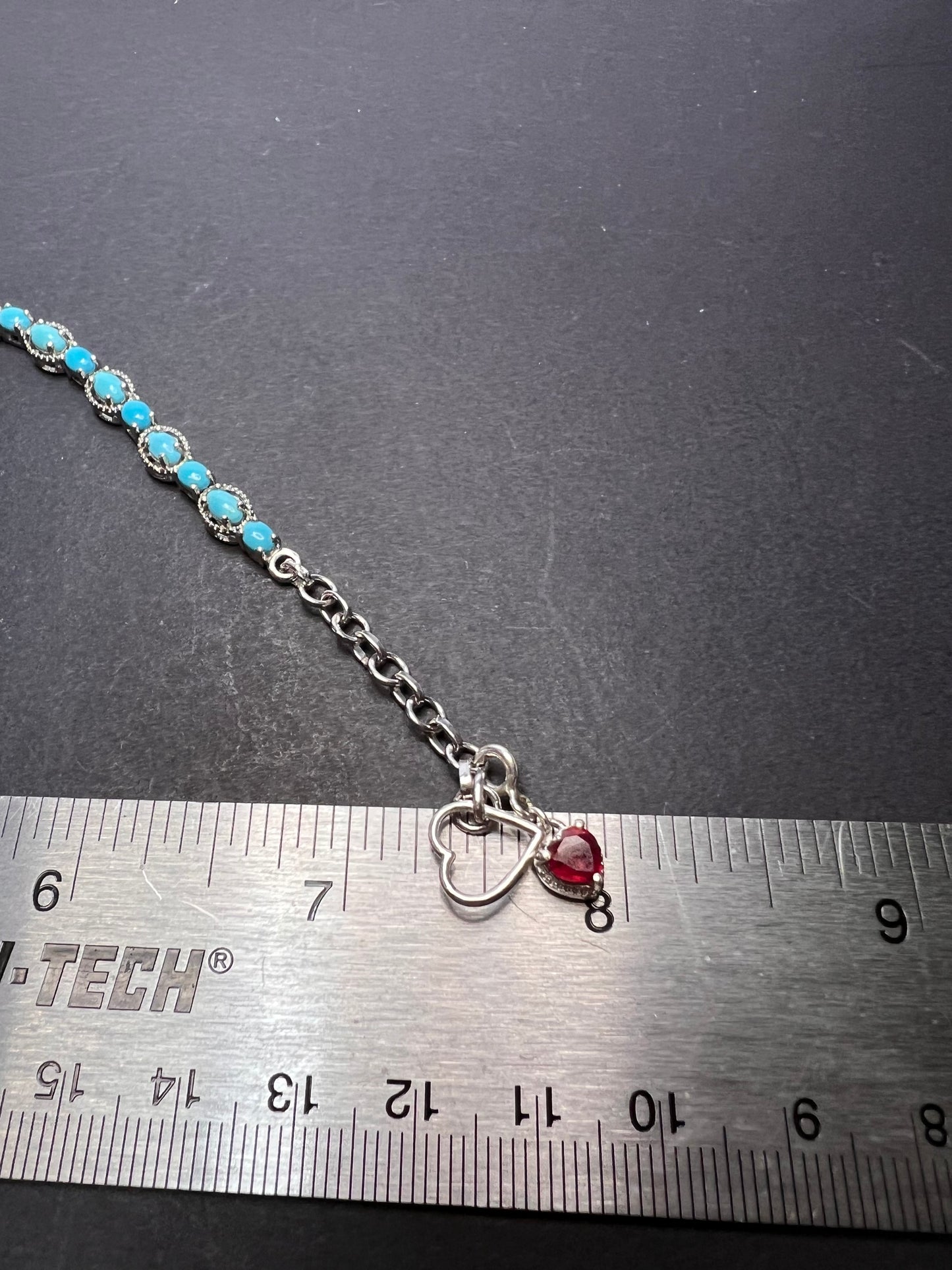 Sleeping Beauty turquoise sterling silver key and heart charm bracelet with toggle clasp and ruby