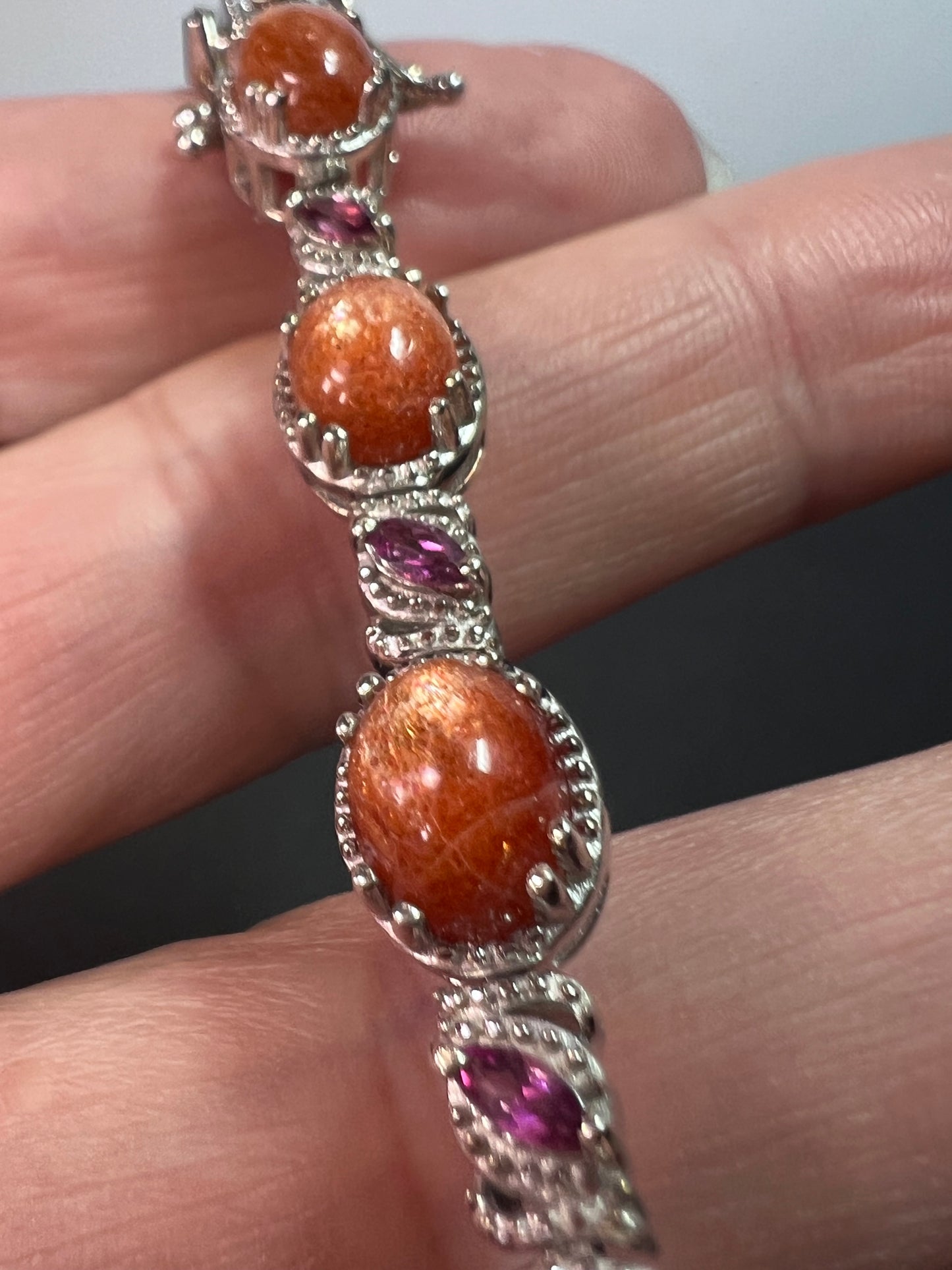 Sunstone and grape rhodolite garnet rhodium over sterling silver tennis bracelet