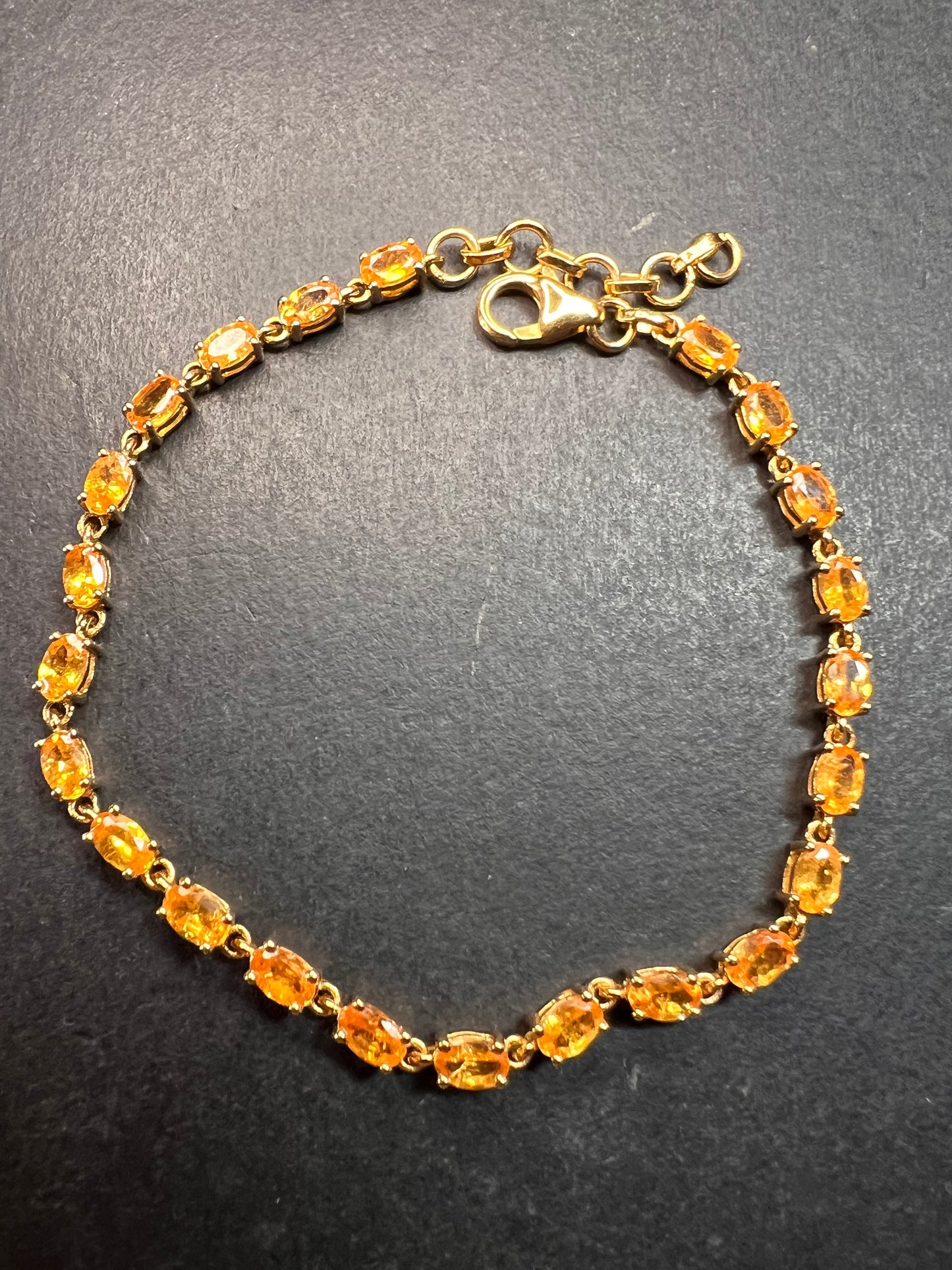 Yellow spessartine garnet tennis bracelet in gold over sterling silver