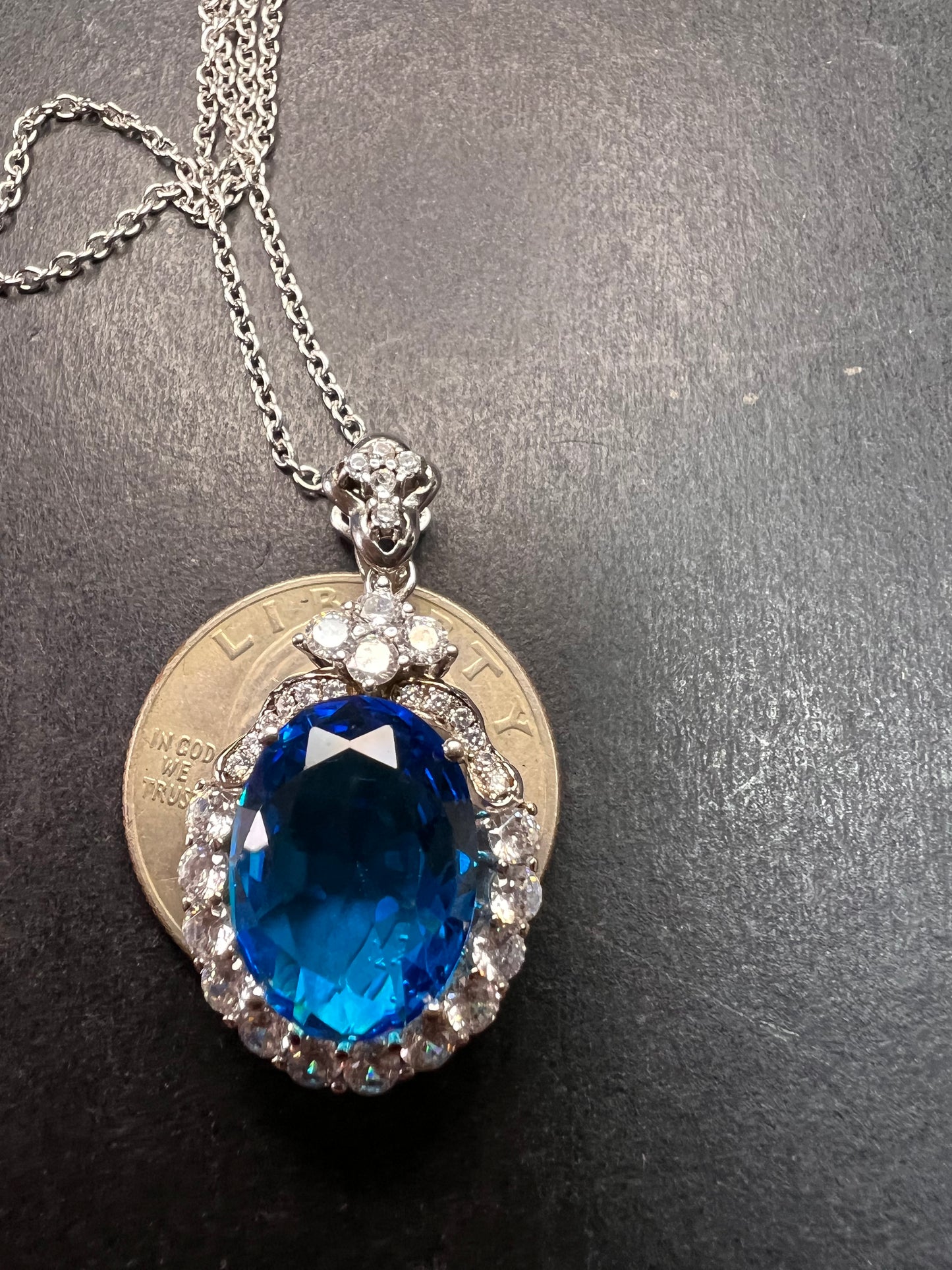 Blue and white CZ sterling silver halo pendant