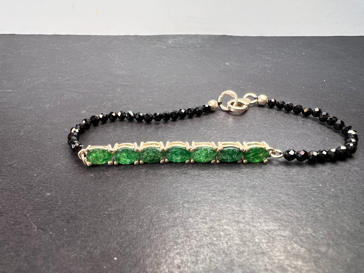 Black spinel and emerald sterling silver bracelet