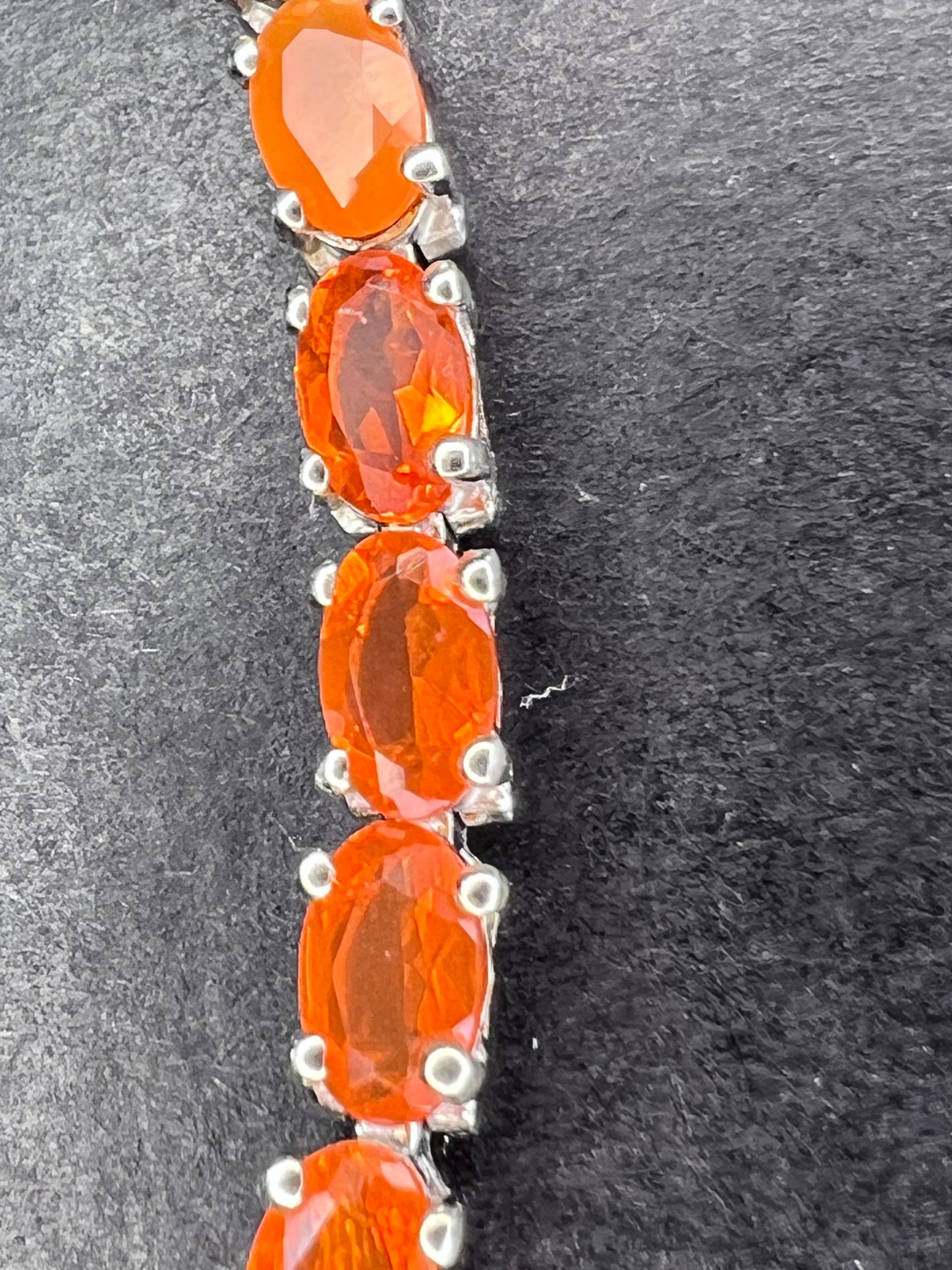 Mexican fire opal rhodium over sterling silver tennis bracelet