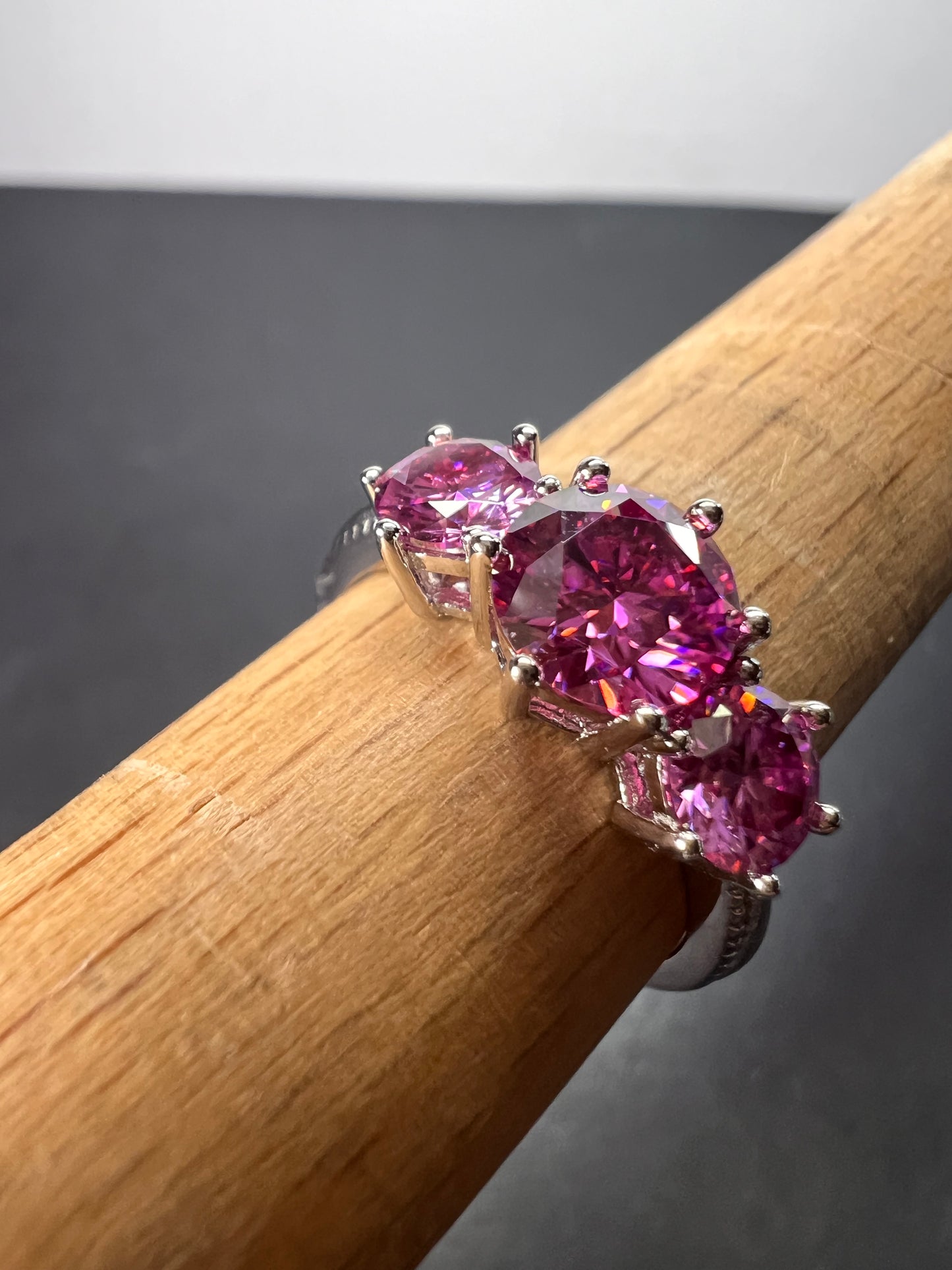 Pink moissanite trilogy ring in platinum over sterling silver size 7