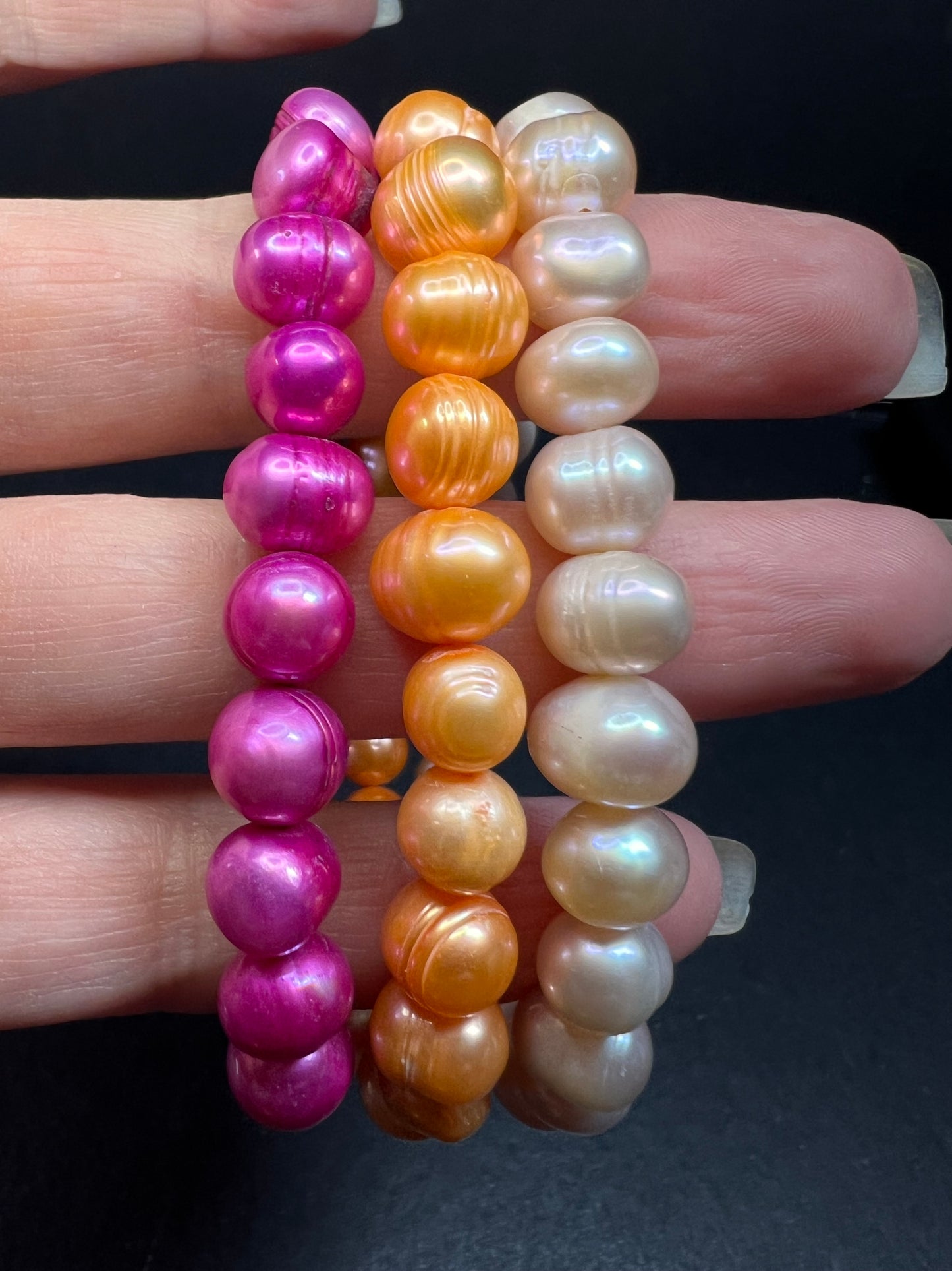 Set of three freshwater pearl stretch bracelets fuchsia pink to tangerine