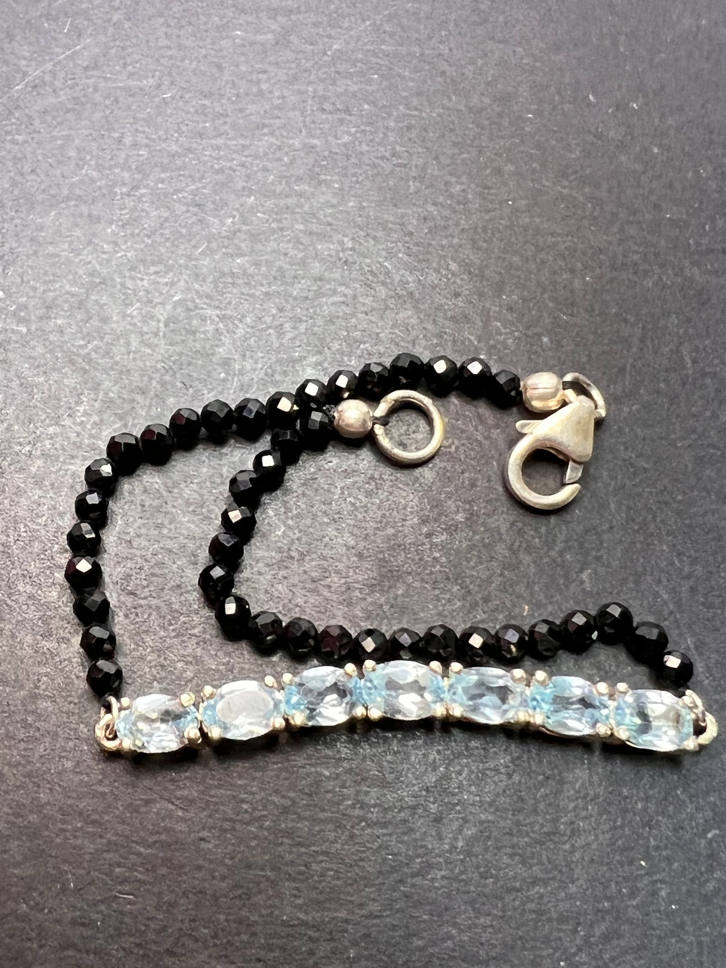 Black spinel and blue topaz bracelet with sterling lobster clasp