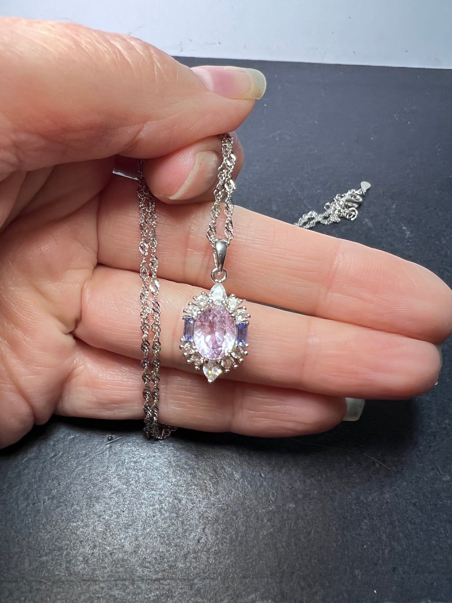 2.11ct Kunzite, 0.18ctw Tanzanite And 0.87ctw White Zircon Rhodium Over Silver halo Pendant With Chain