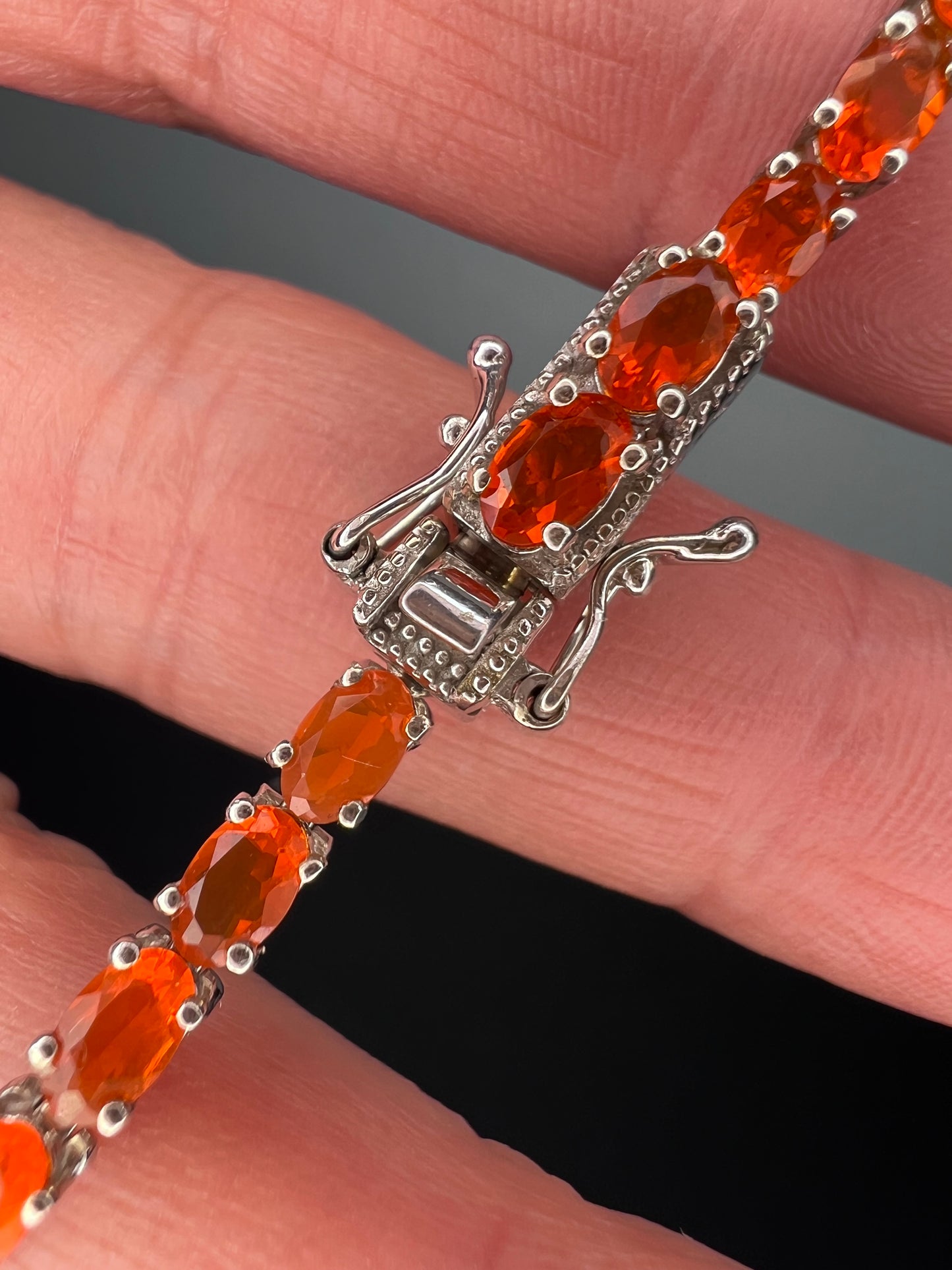 Mexican fire opal rhodium over sterling silver tennis bracelet