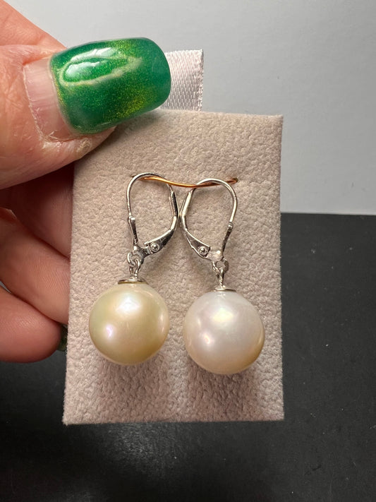 White cultured freshwater pearl earrings in rhodium over sterling silver lever backs