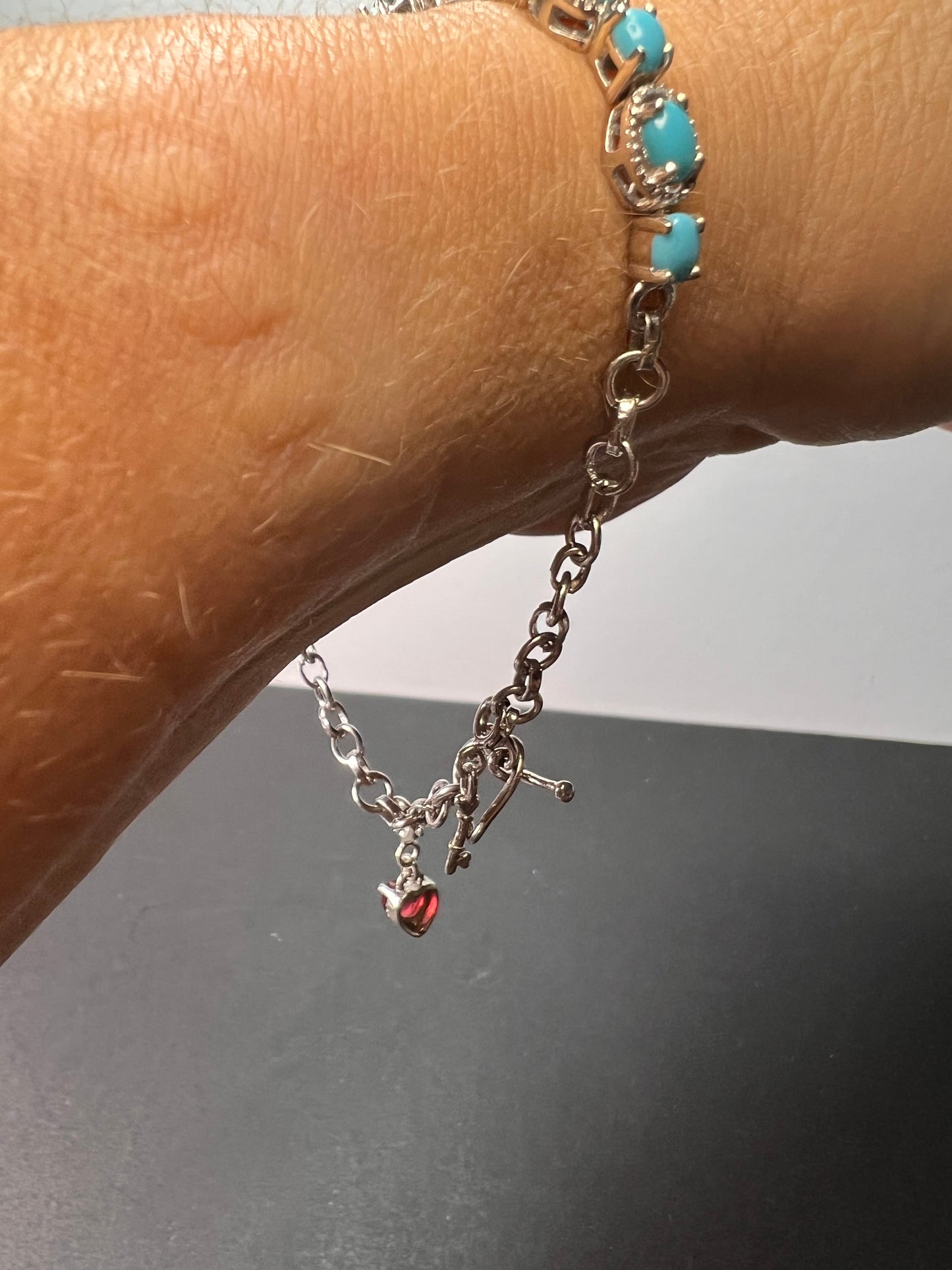 Sleeping Beauty turquoise sterling silver key and heart charm bracelet with toggle clasp and ruby