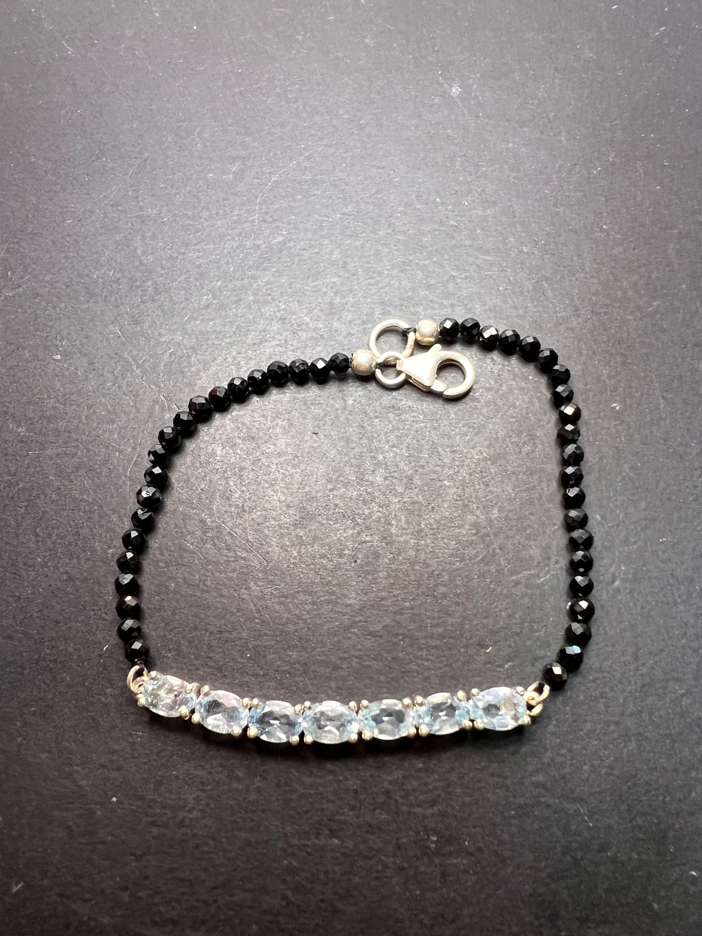 Black spinel and blue topaz bracelet with sterling lobster clasp