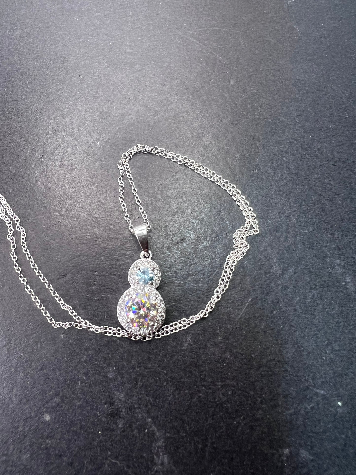 Strontium titanate and blue topaz sterling silver halo pendant with 18 inch chain necklace